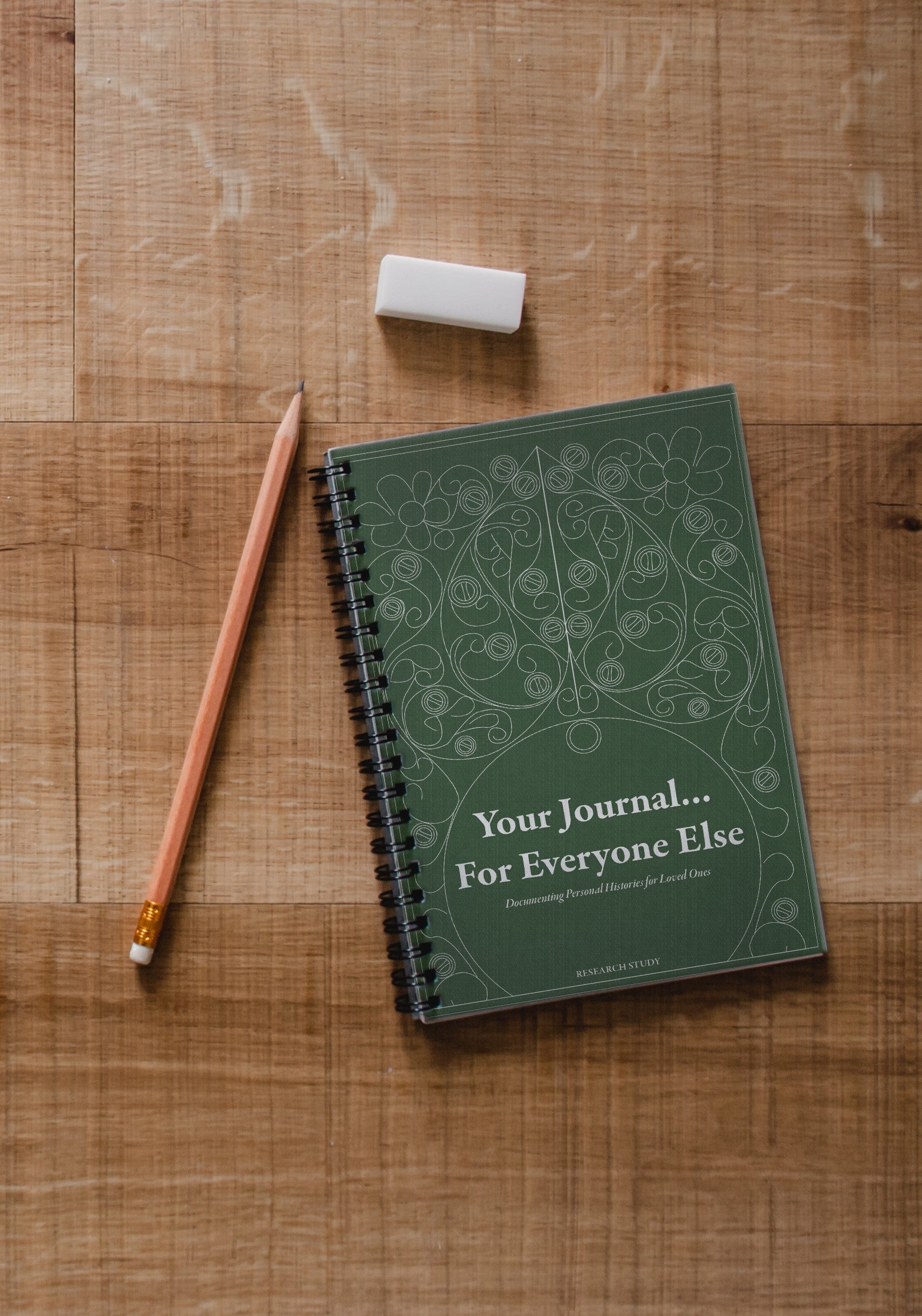 Journal on table with pencil.