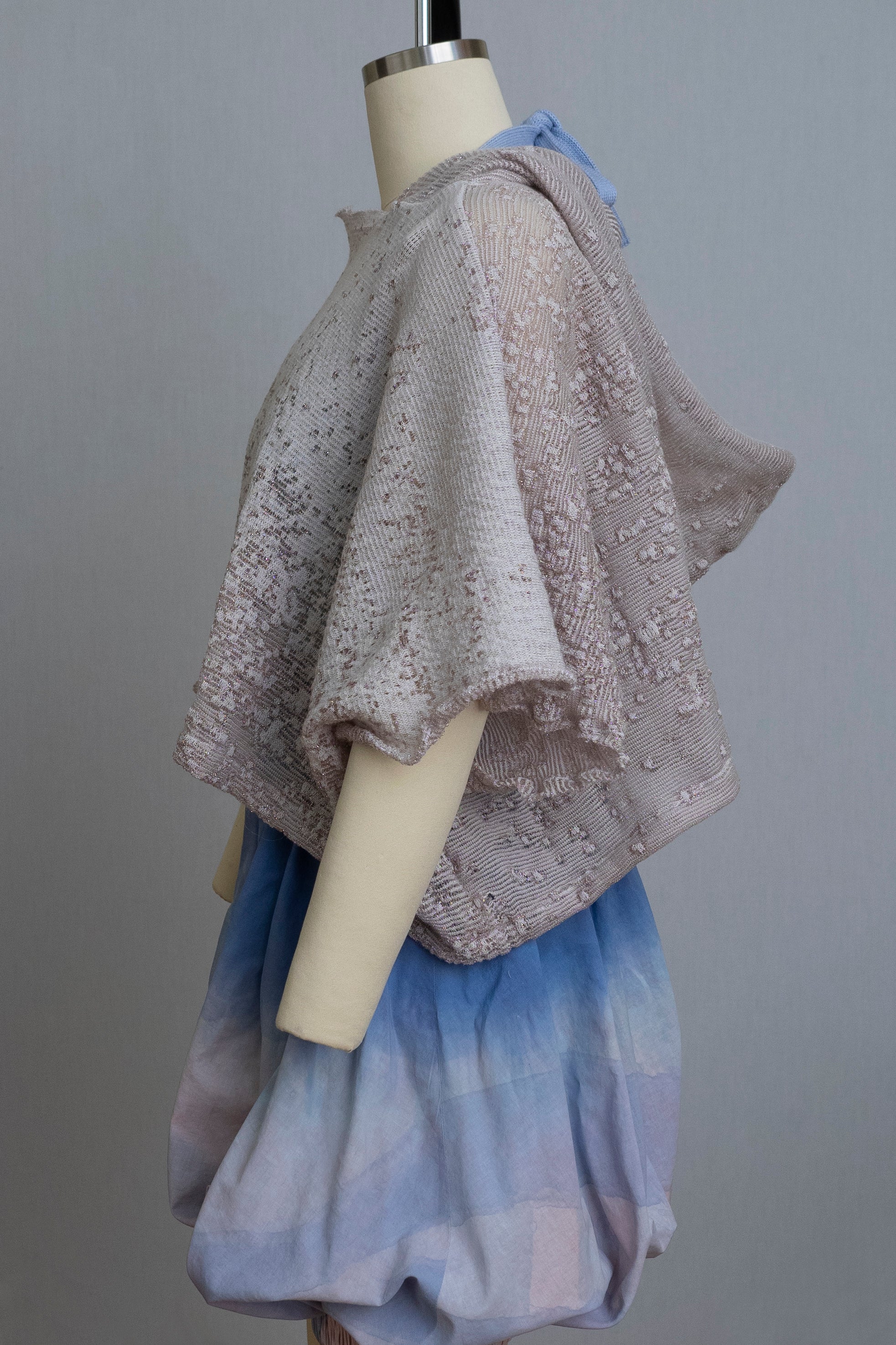 dress form wearing bloomers and a grey knit hooded sweater