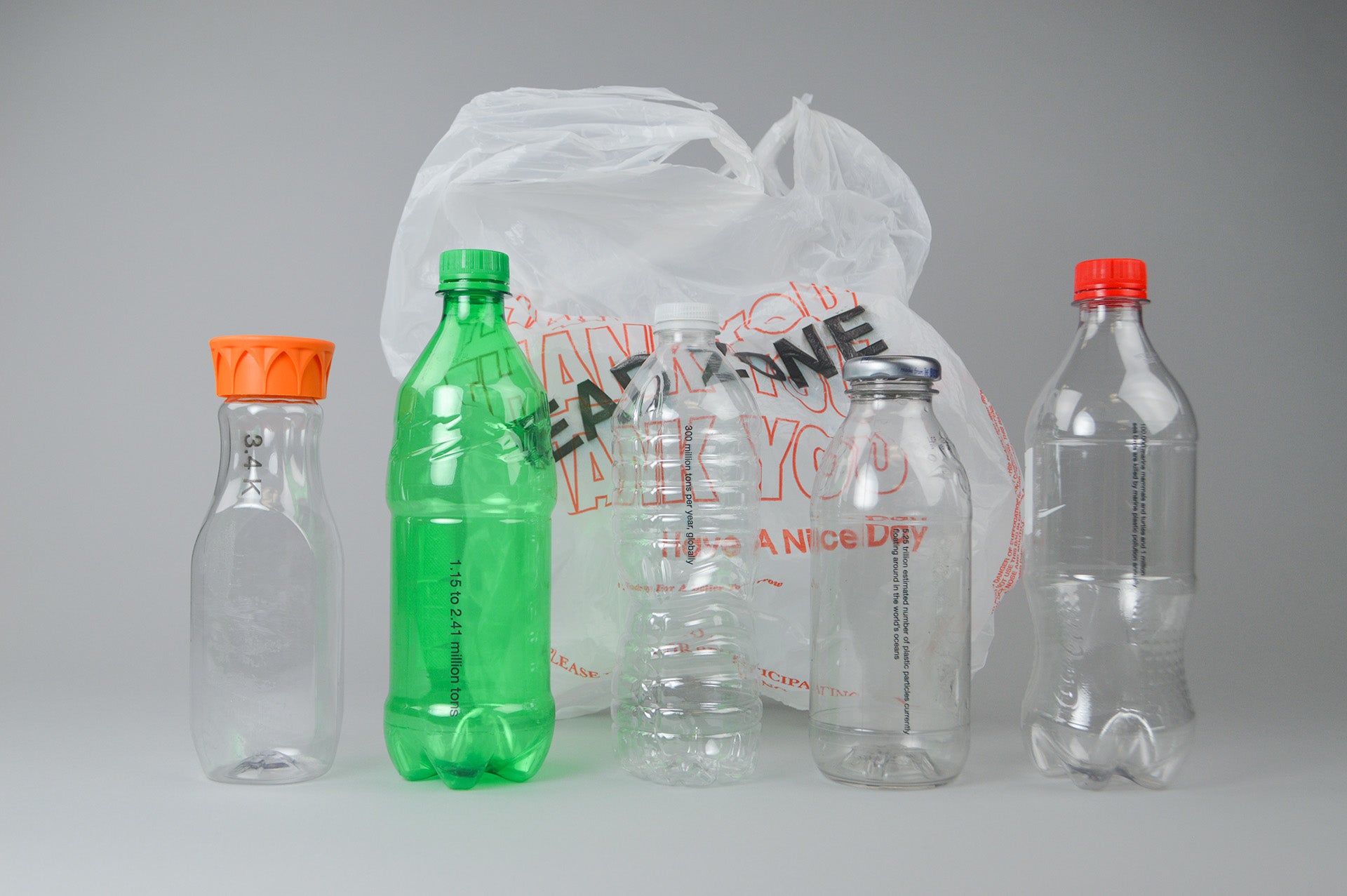 Five plastic bottles with a plastic bag behind them with the text 'Dead Zone' printed on it