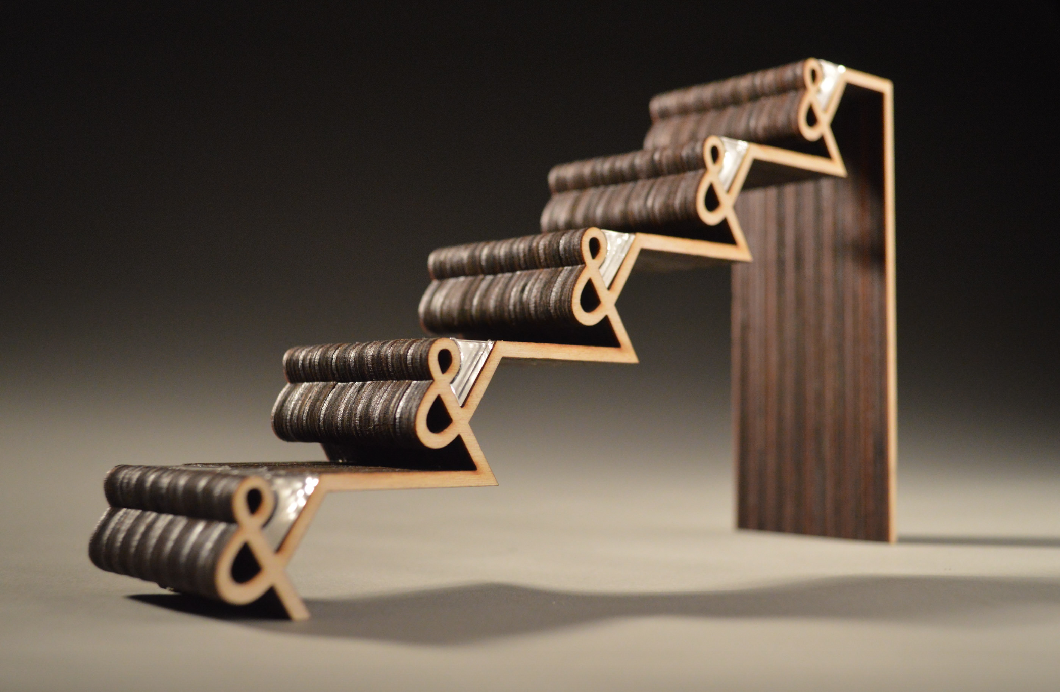 A wooden staircase built of ampersands