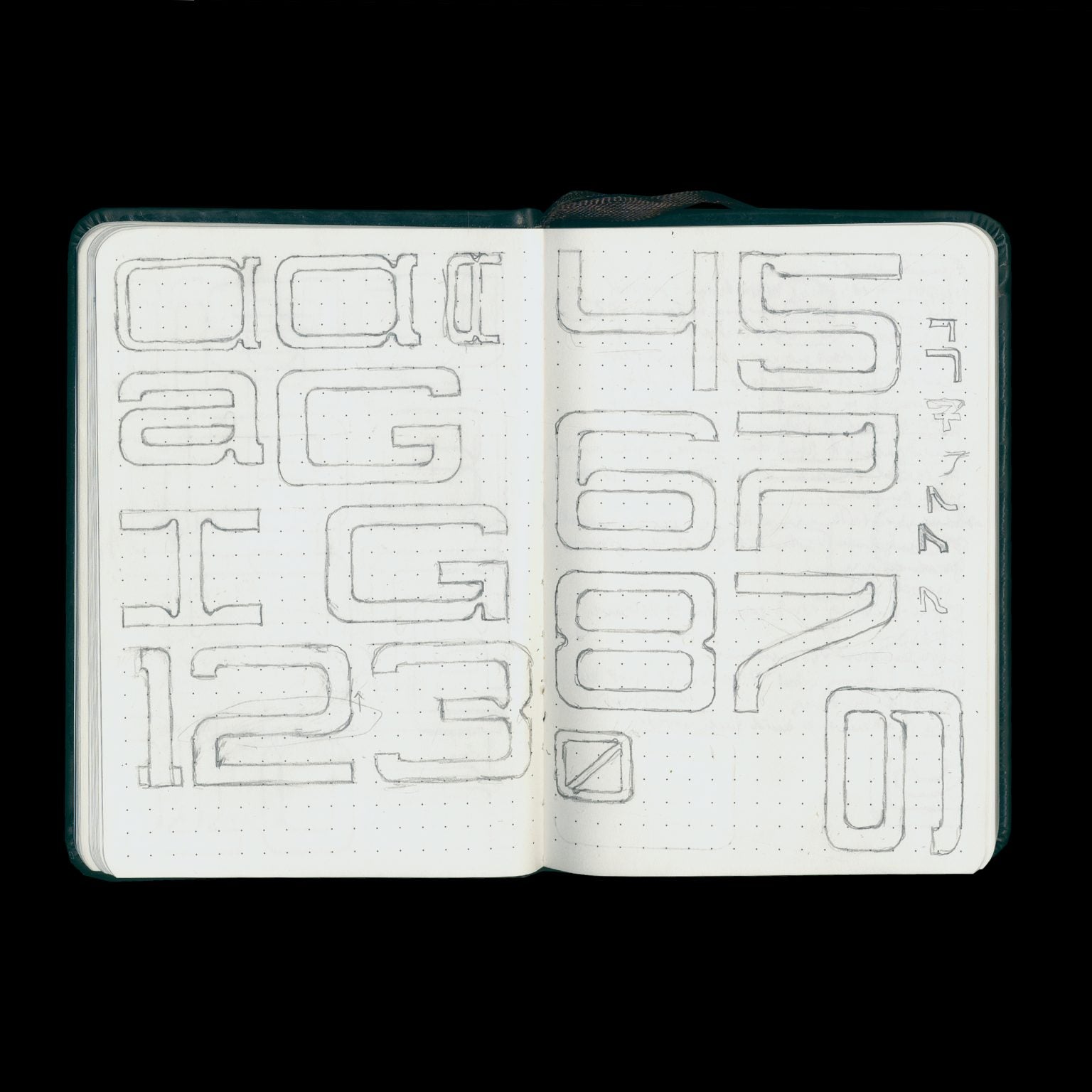 Open sketchbook with sketches of the typeface 'Junction'