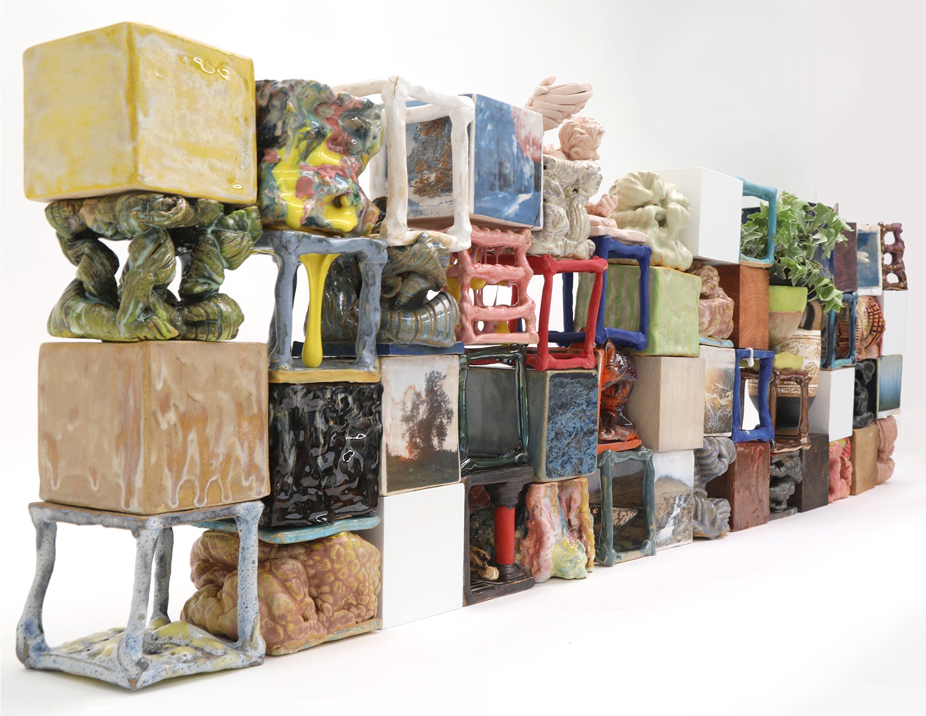 Collection of a variety of ceramic cube forms composed into wall shape. 