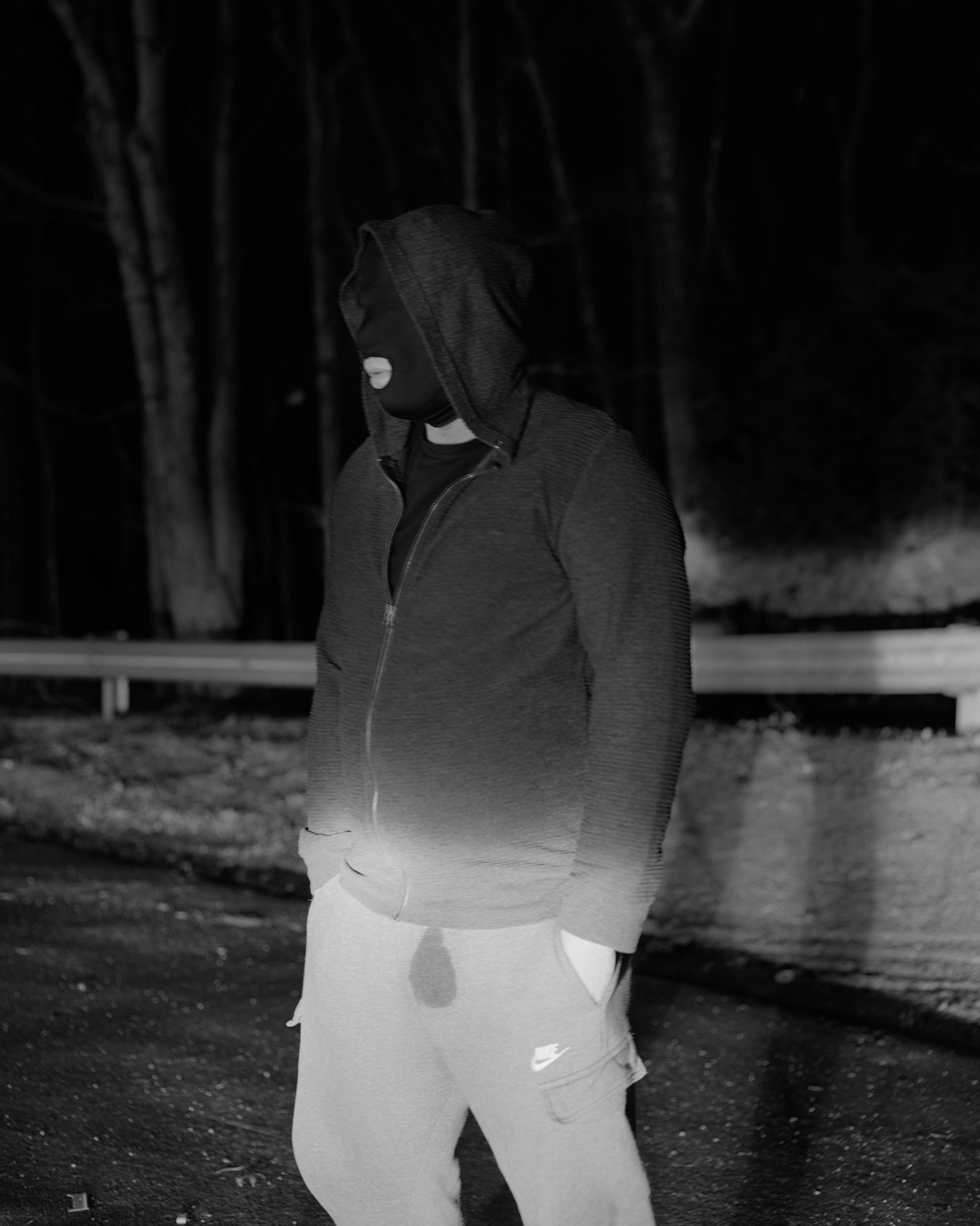 a piss soaked figure in black and white 