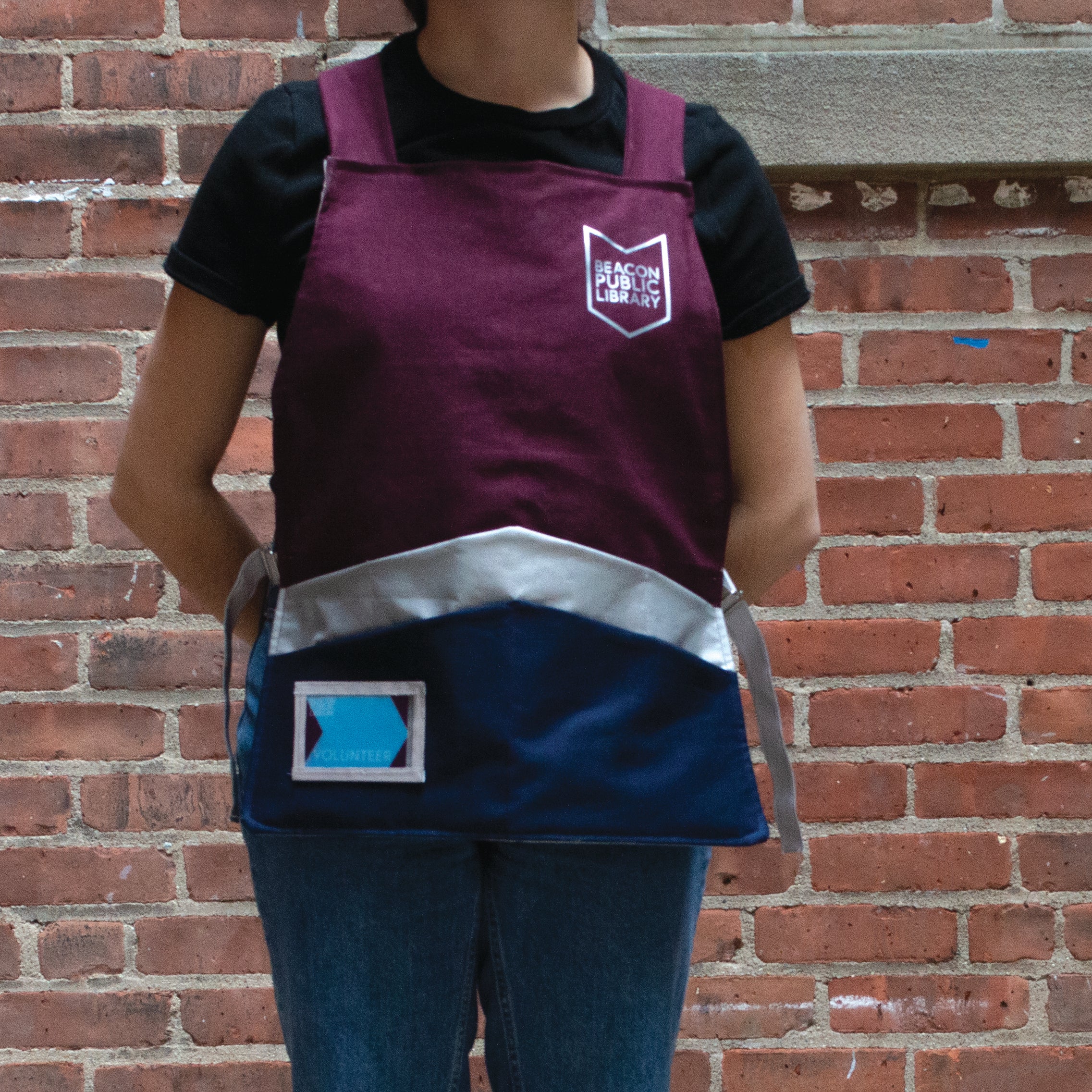 Wearing the library apron