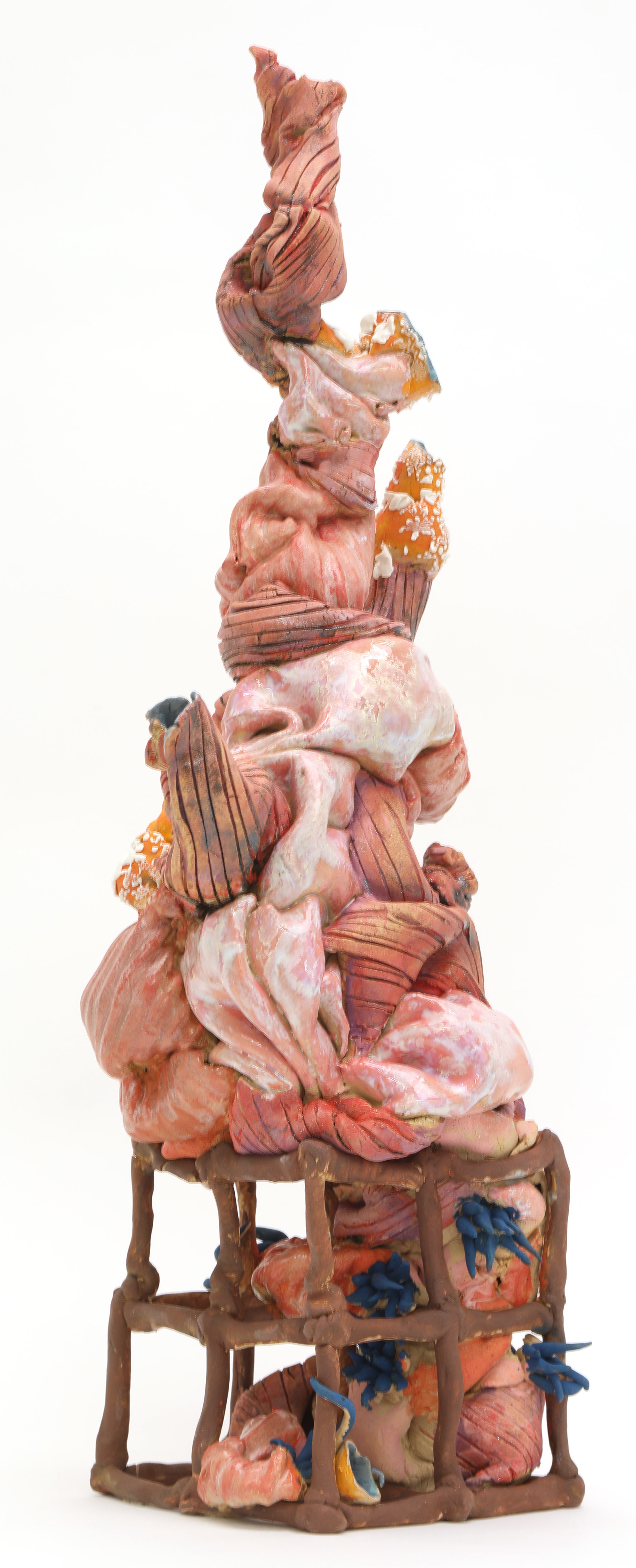 Abstract squishy-looking pink ceramic form that is vaguely tree-like. 