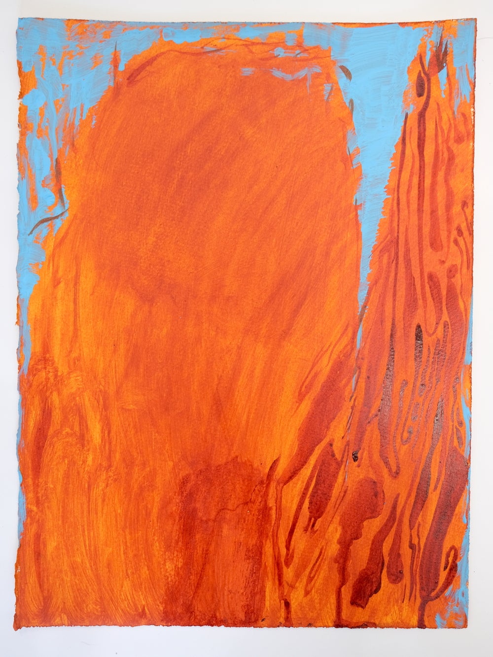 Photo of orange and blue drawing of a mountain that is also a head in profile with an arm lifted in prayer