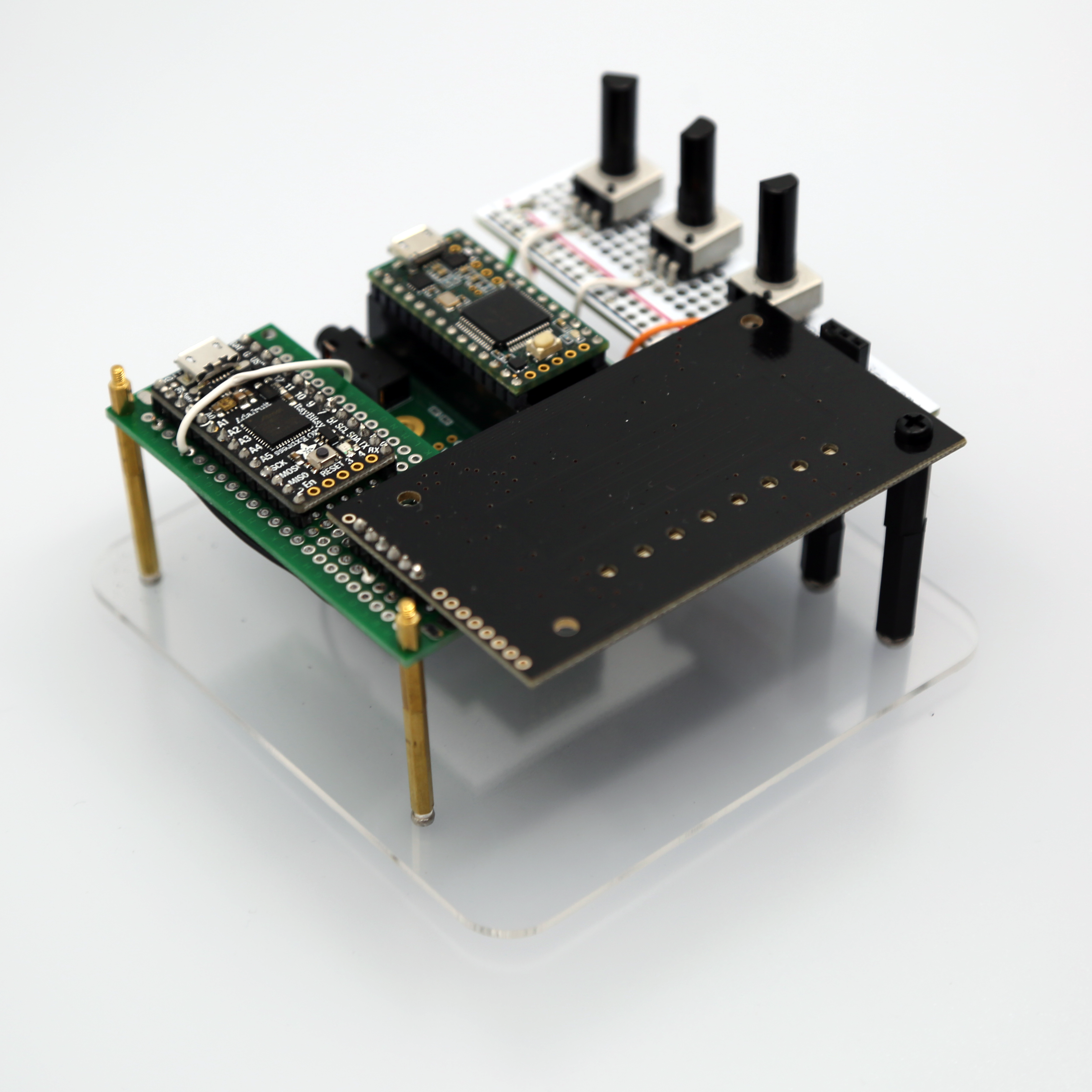Image of an instrument consisting of circuit boards and small electronics components wired together.
