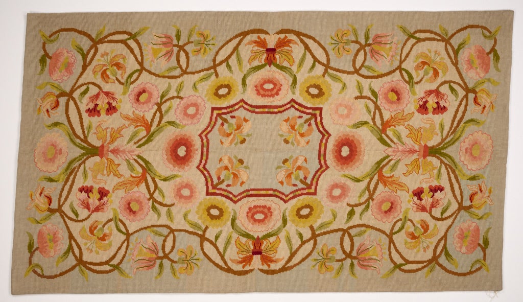 /Floral%20design%20with%20scalloped%20rectangular%20center%20medallion.%20Vines%20with%20salmon-colored%20flowers%20twist%20around%20it.%20Palette%20includes%20tan%2C%20peach%20tones%2C%20green%2C%20and%20light%20blue.