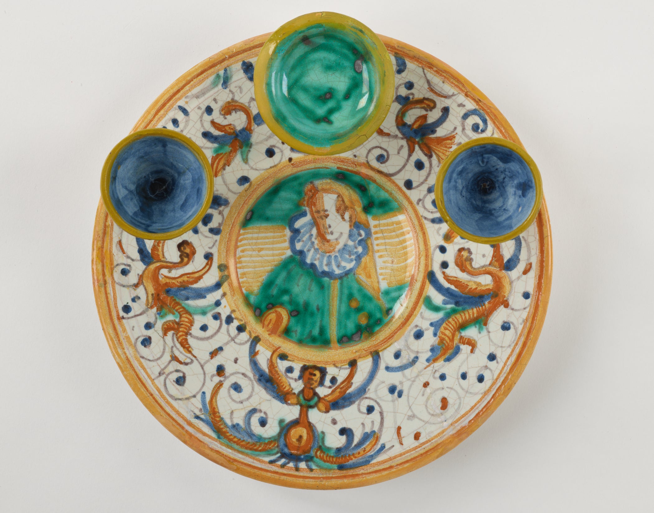 /%20A%20lead-glazed%20earthenware%20plate%20that%20has%20different%20compartments.%20There%20are%20yellow%2C%20white%2C%20blue%2C%20and%20green%20glazed%20decorations.