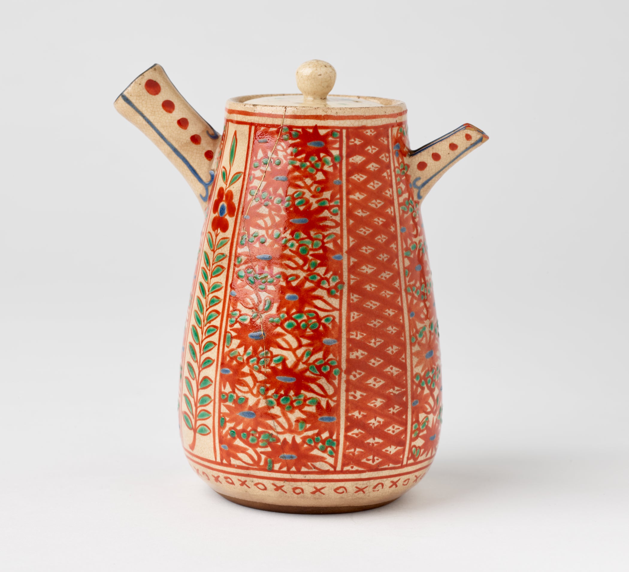 /A%20stoneware%20teapot%20with%20enamel%20floral%20and%20abstract%20decorative%20motifs%20that%20are%20red%2C%20green%2C%20and%20blue.%20