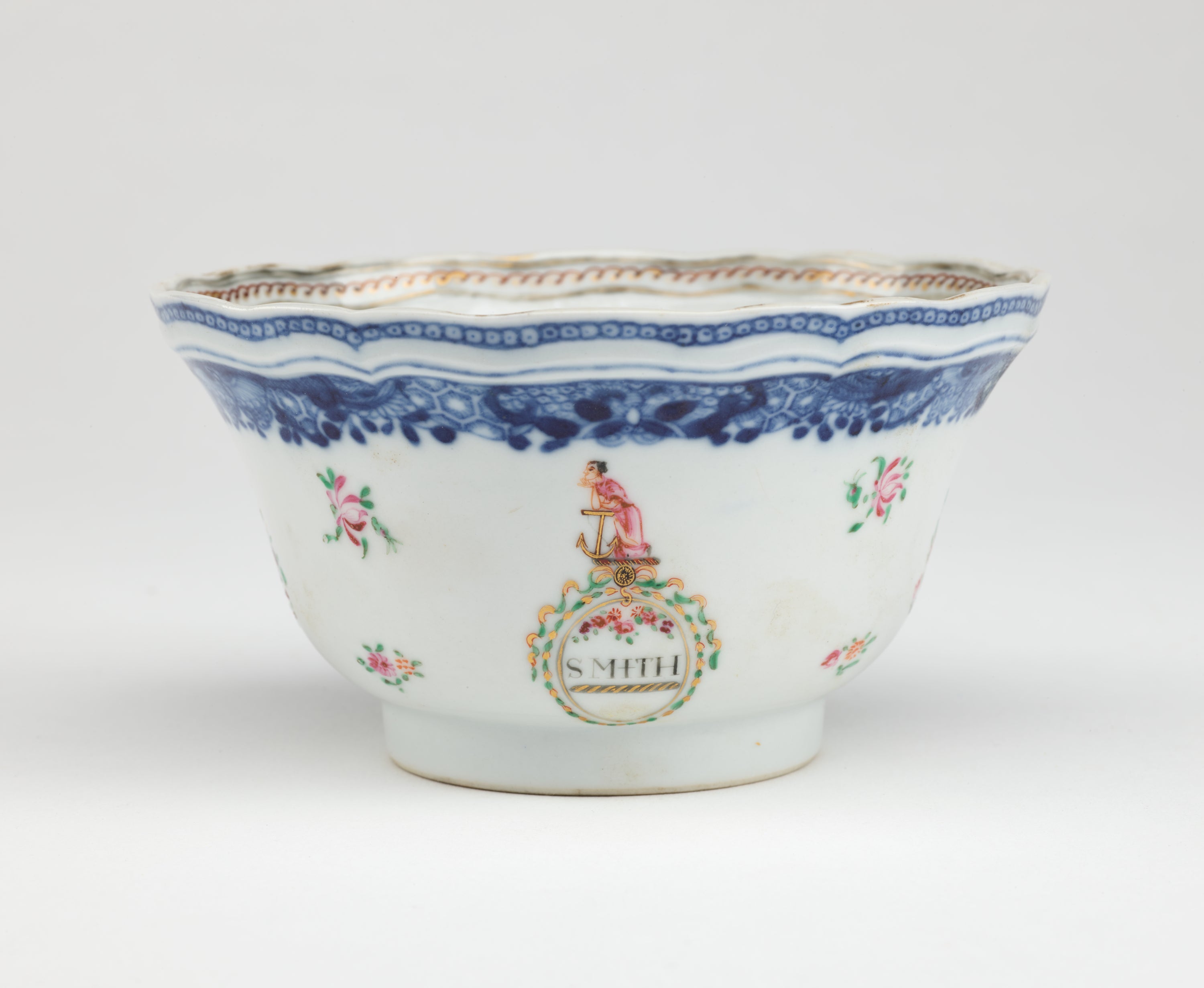 /A%20porcelain%20sugar%20bowl%20with%20glided%2C%20blue%2C%20green%2C%20and%20pink%20decorations.%20The%20decorations%20are%20floral%2C%20as%20well%20as%20one%20figure%2C%20and%20a%20word%20saying%20%E2%80%9CSMITH%E2%80%9D.