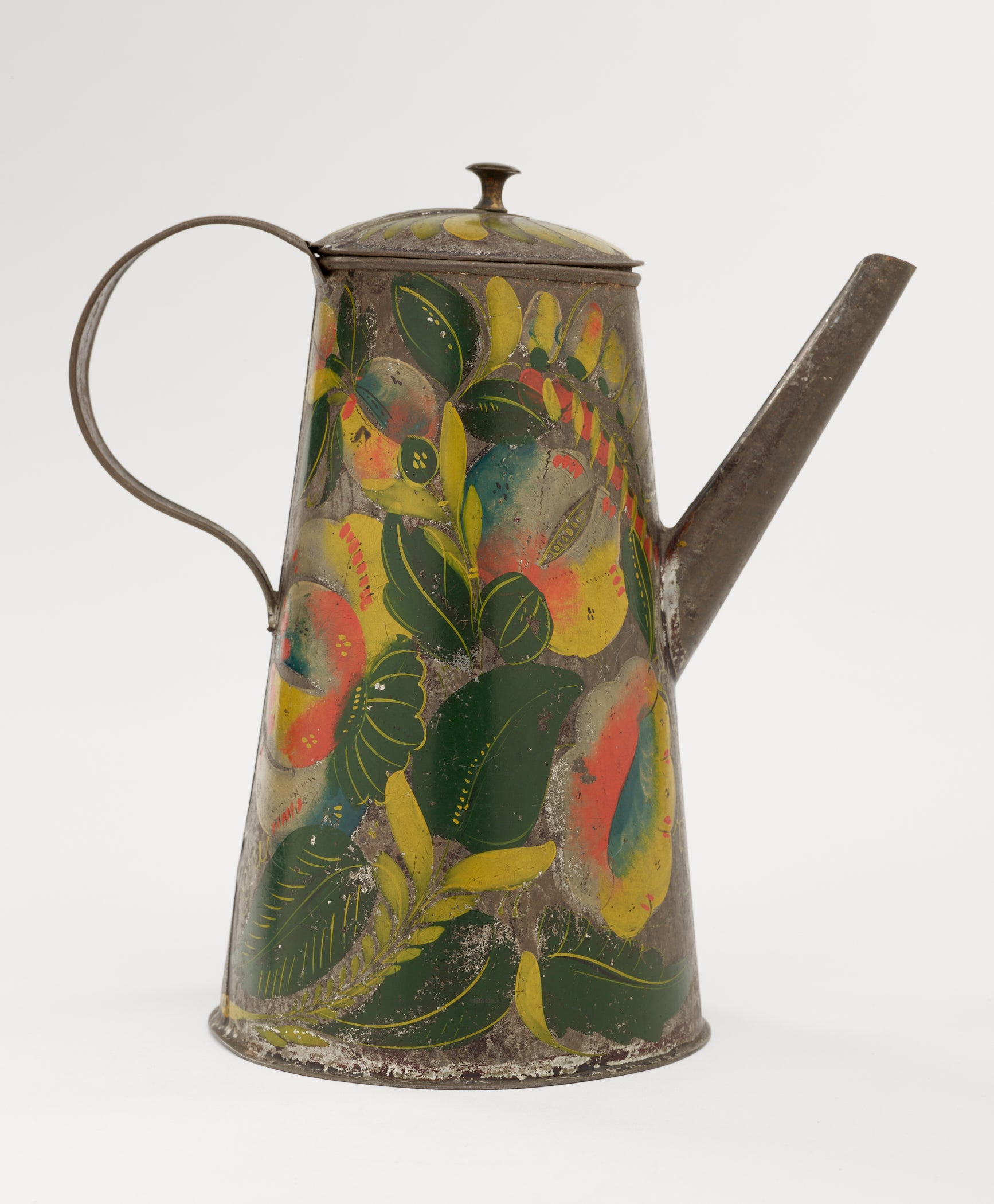 /A%20tin%20coffee%20pot%20with%20painted%20orange%2C%20yellow%2C%20and%20green%20floral%20decorations.