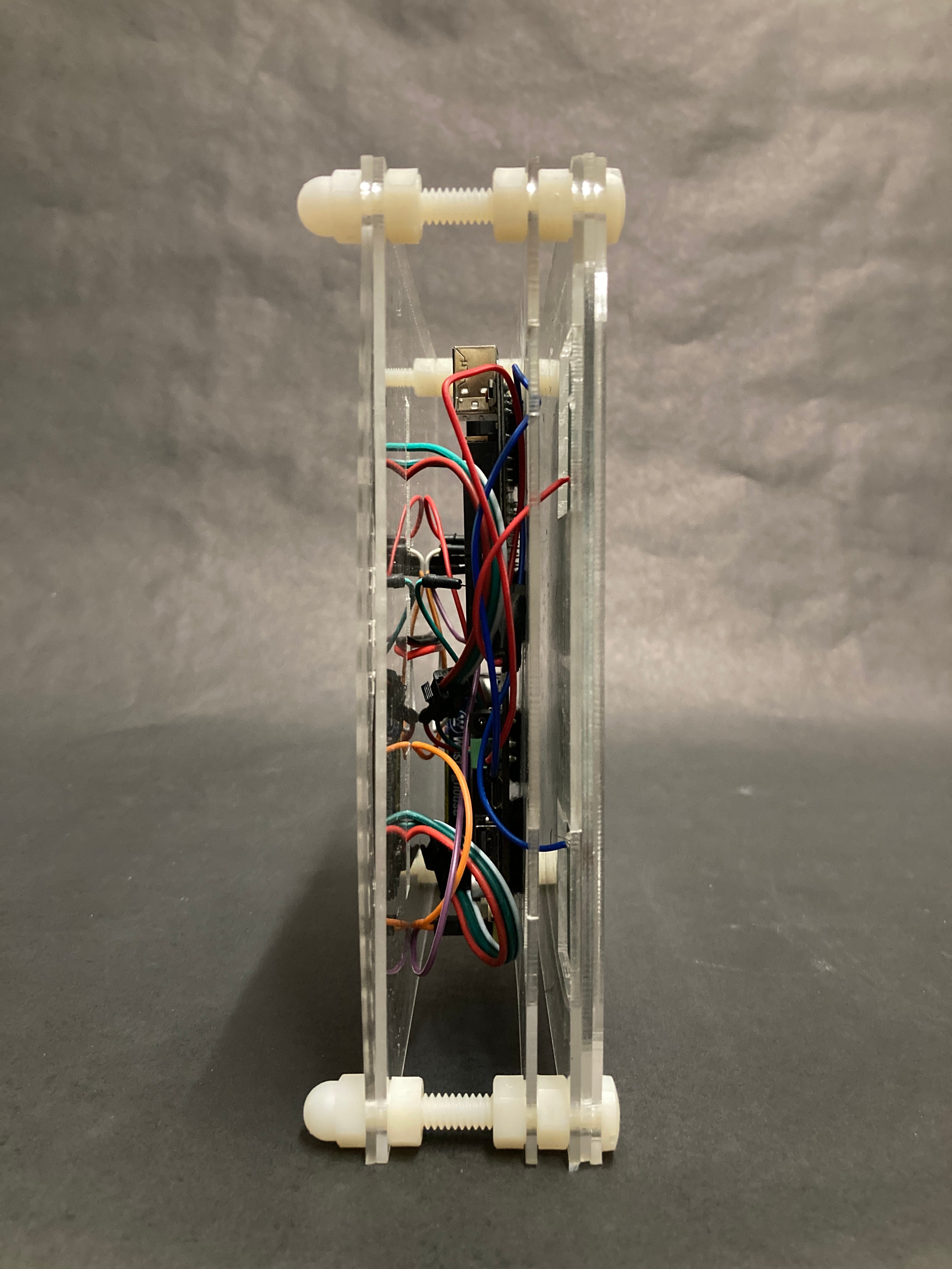 Two panel sandwiching a series of electronic boards that controls and stores the light emitted and absorbed.