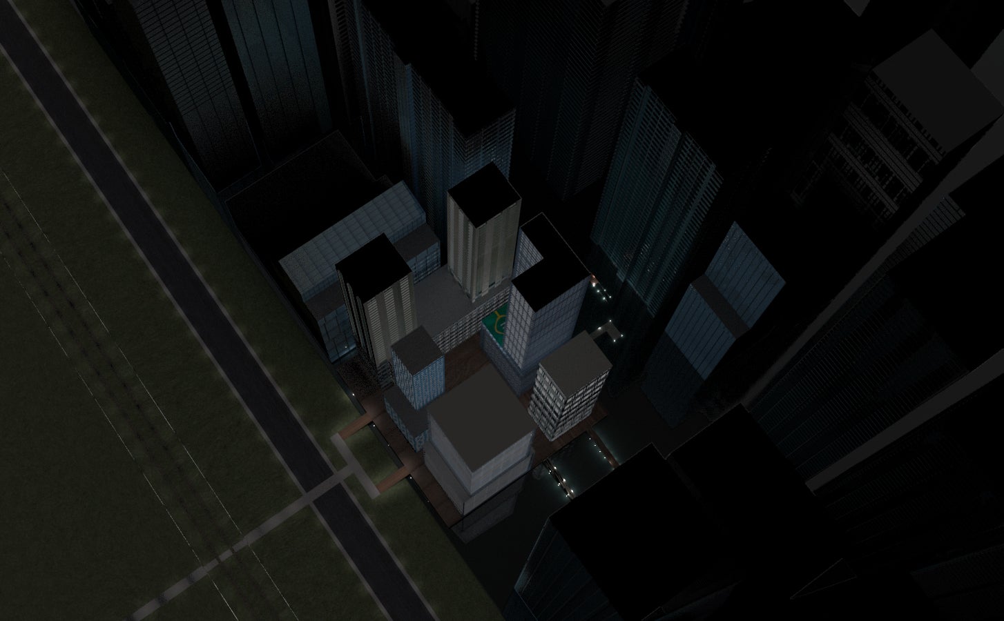 This is an aerial view of a block of stilted buildings at night.