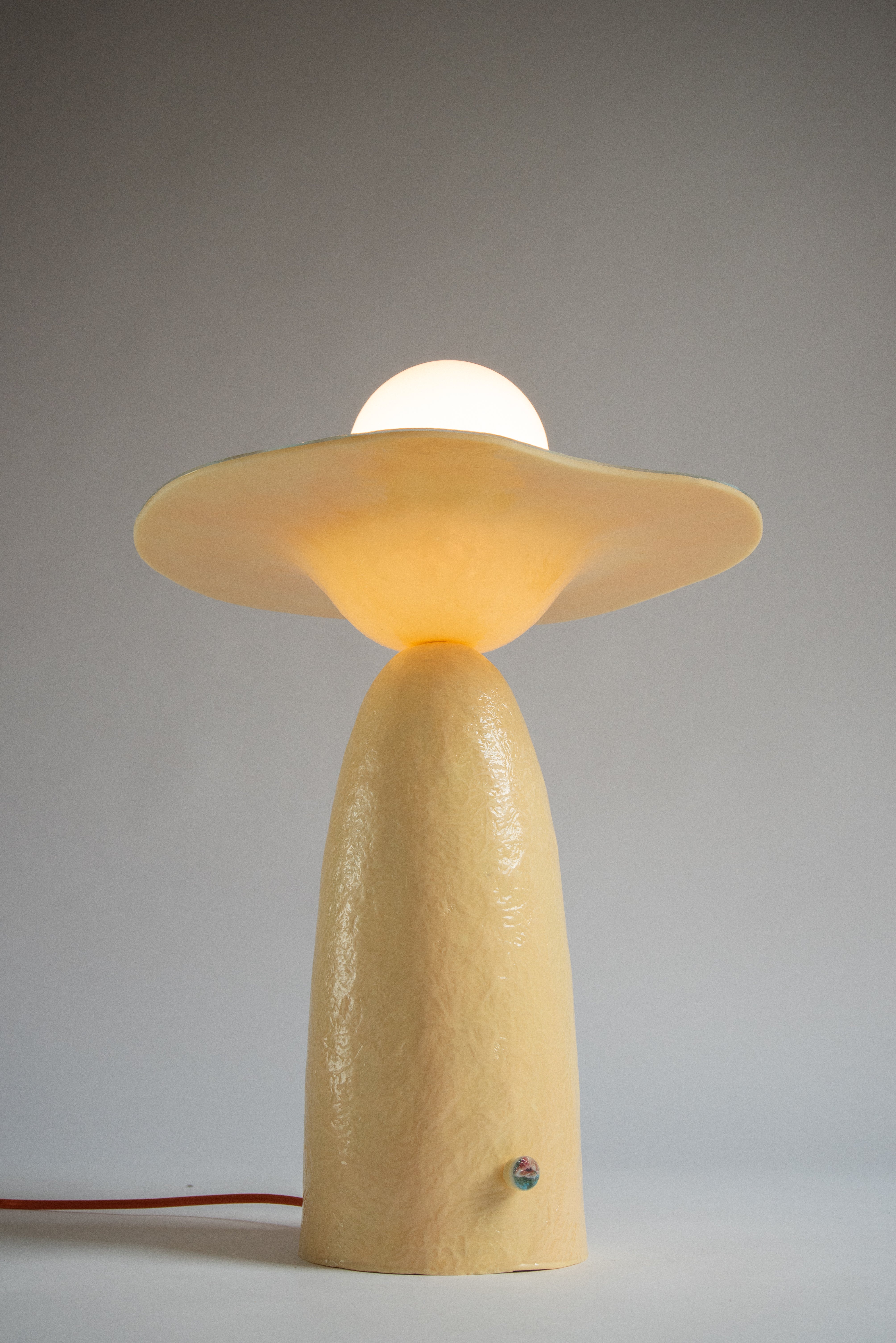 Detail image of the glowing underside of horizon lamp.