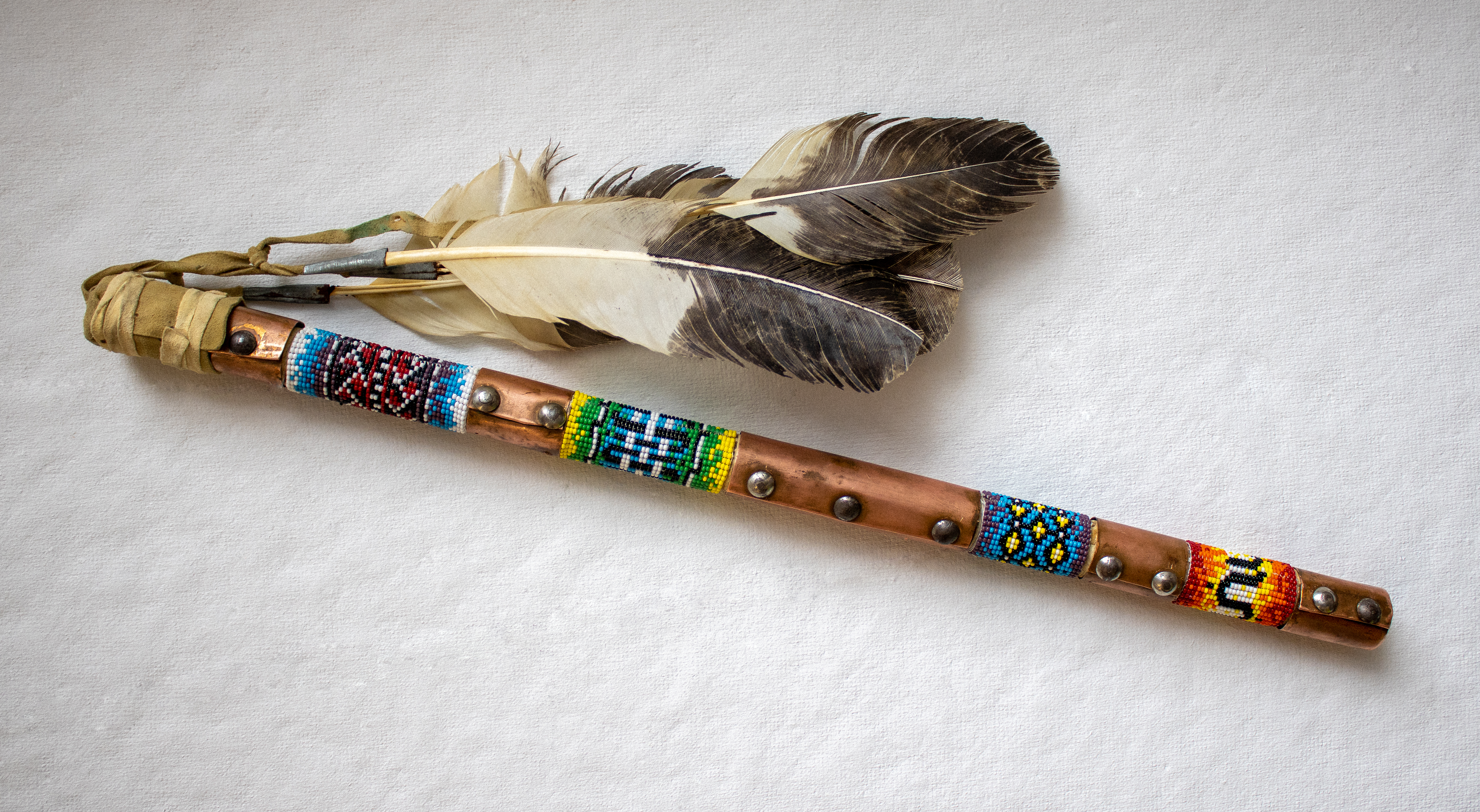 A re-beaded talking stick made to facilitate talking circles.