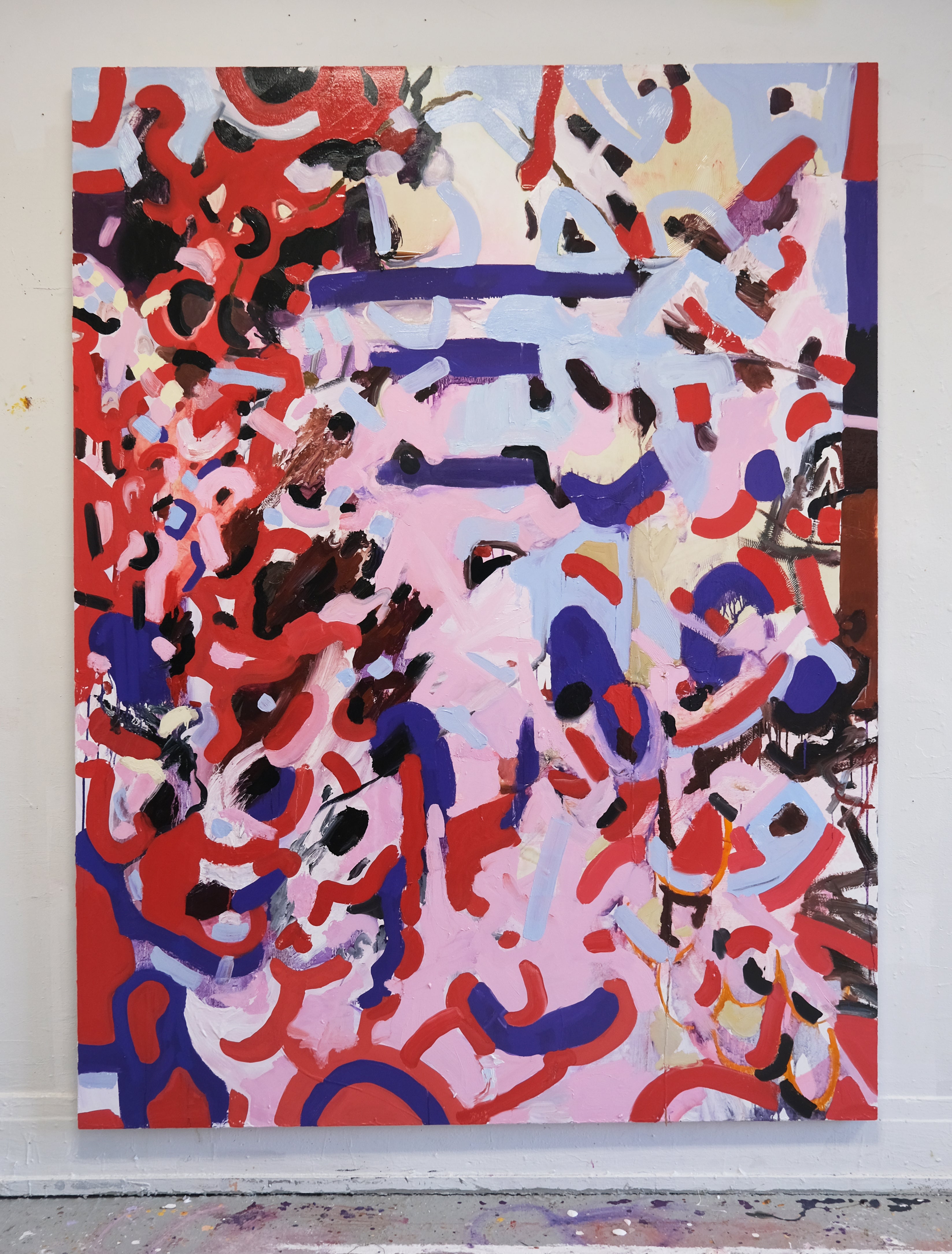 A vertical abstract painting with a red, pink, purple, and blue color pallet. 