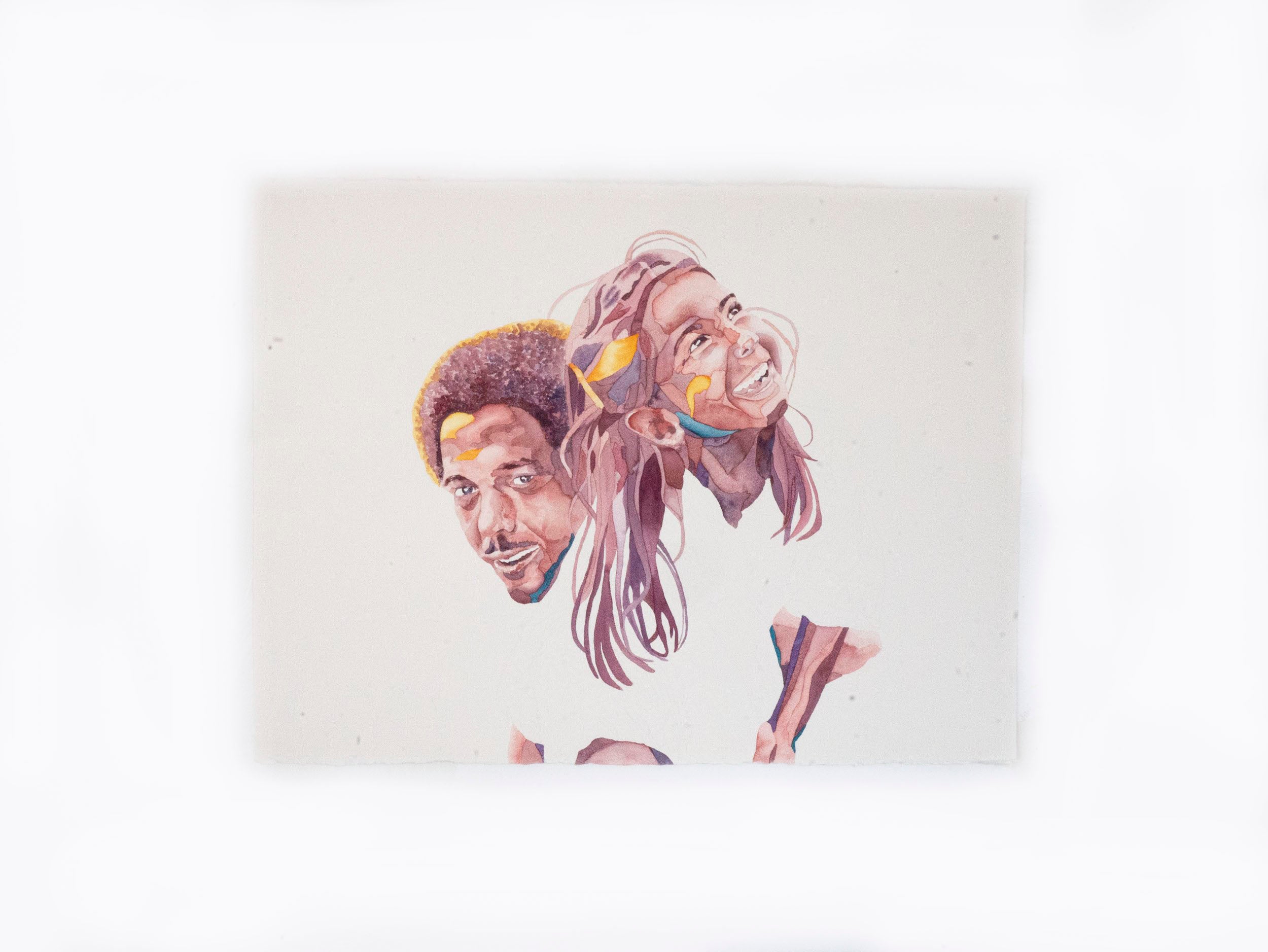 Portrait of an Uncle lifting his niece up over his shoulder, both smiling.
