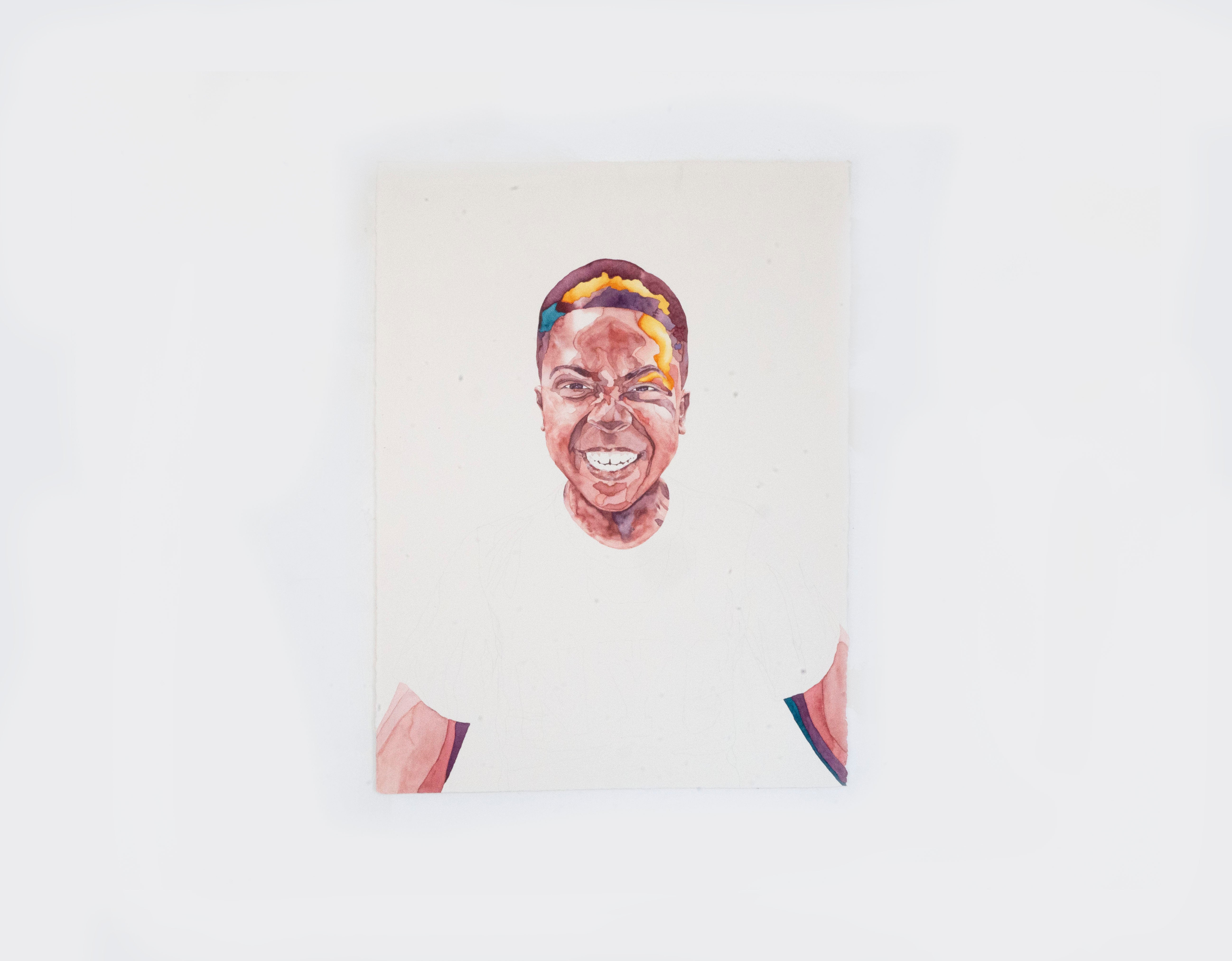 Portrait of a young boy making a smiling silly face. 