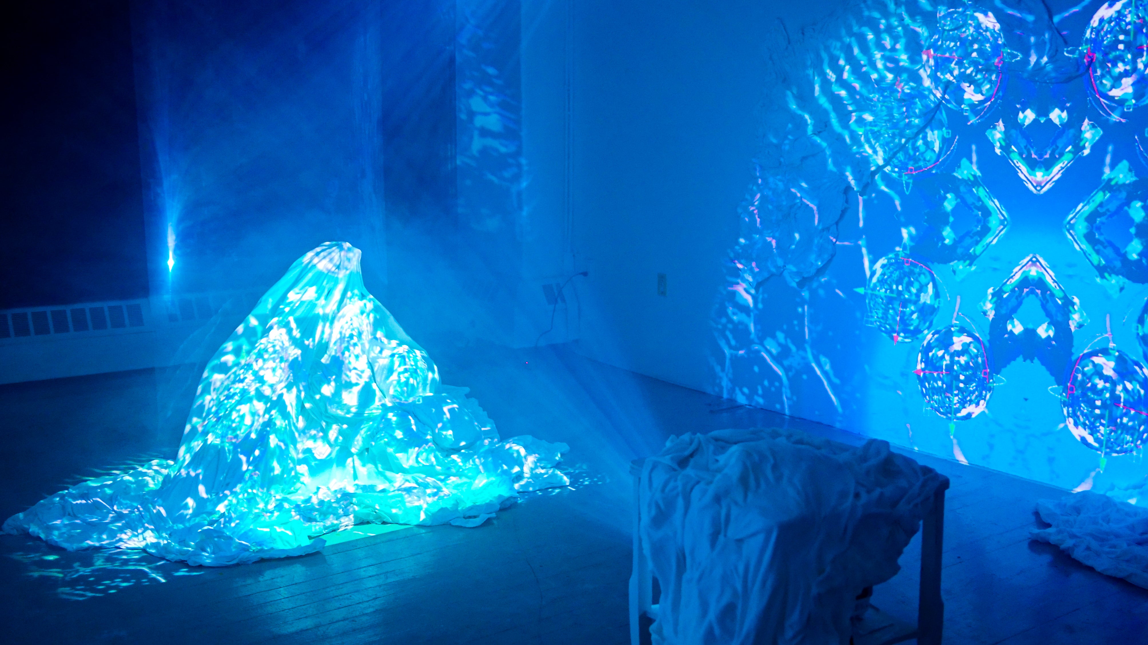  Photogrammetry animation of Cherenkov radiation from RINSC nuclear reactor projected on an installation of bedsheets, salt, and melatonin.