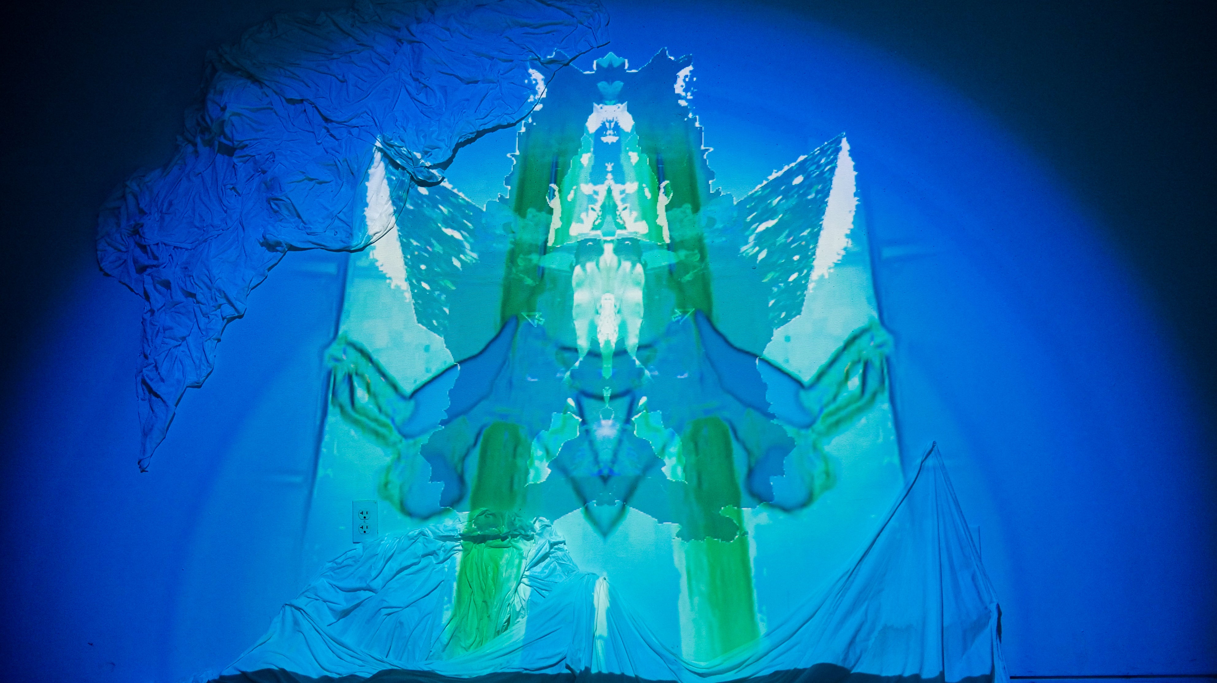 Photogrammetry animation of Cherenkov radiation from RINSC nuclear reactor projected on an installation of bedsheets, salt, and melatonin.