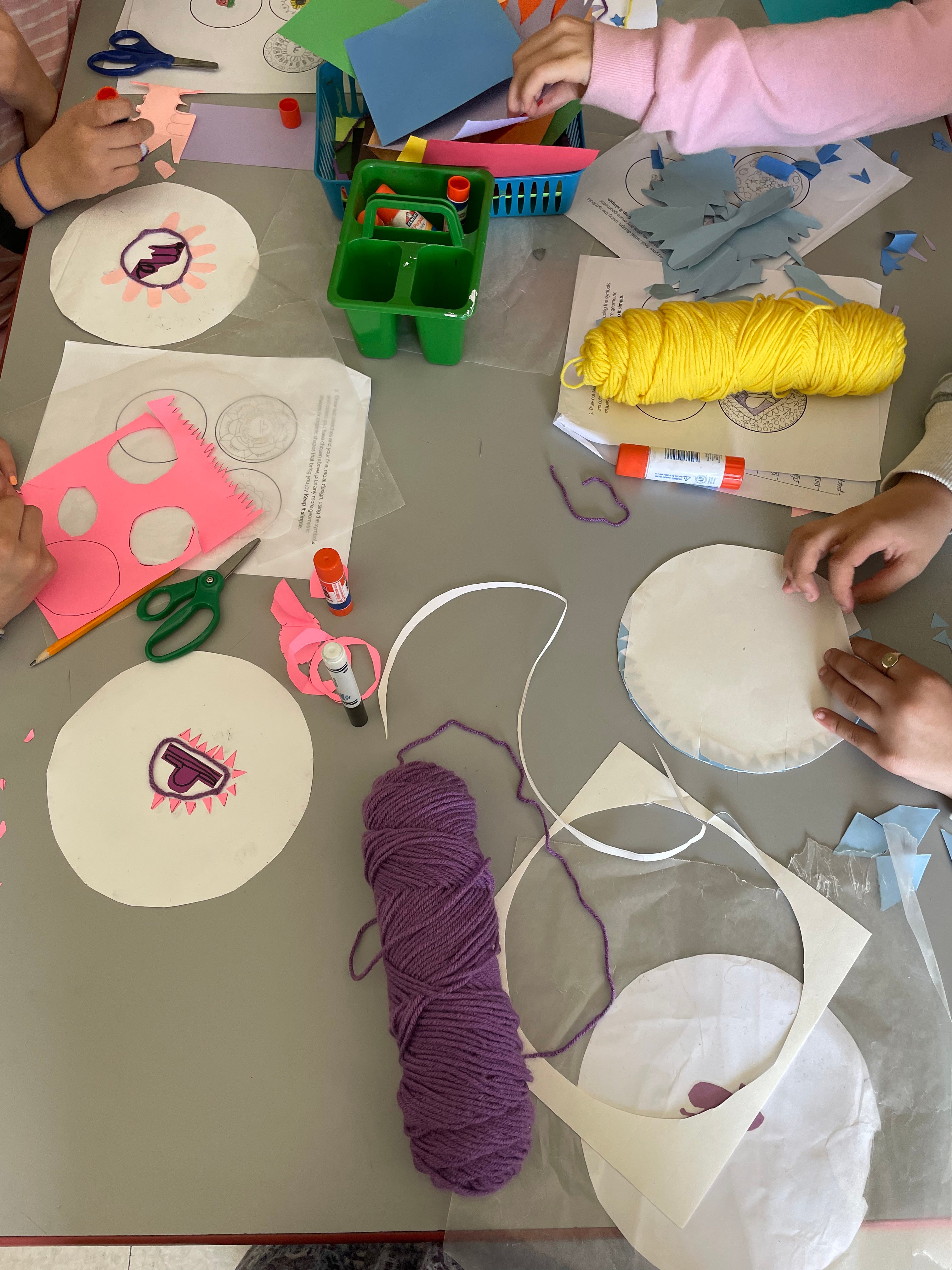 Students work on radial designs inspired by the crochet artist Xenobia Bailey. 