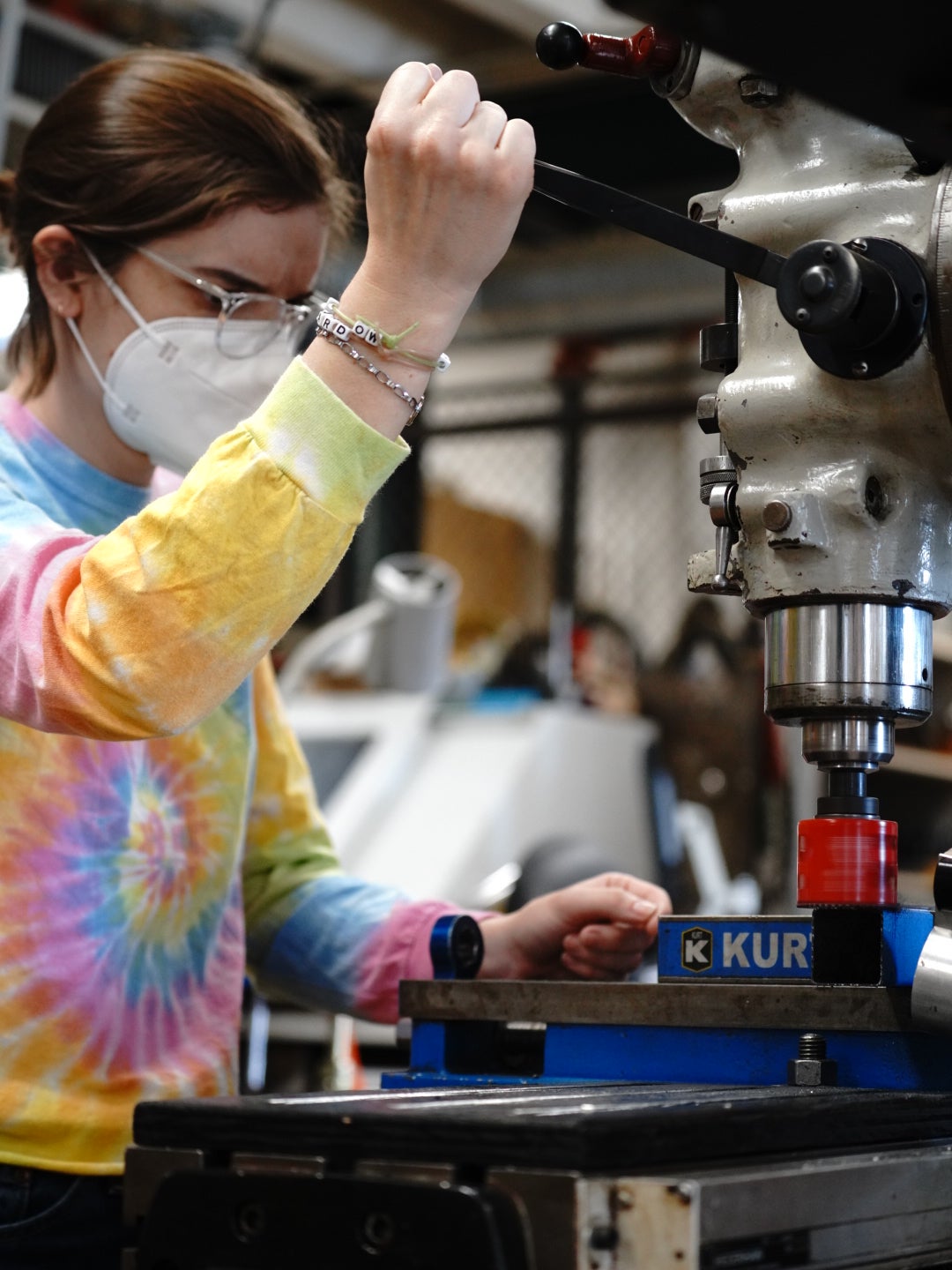 Image of the artist cutting carbon frame tubing for bicycle construction