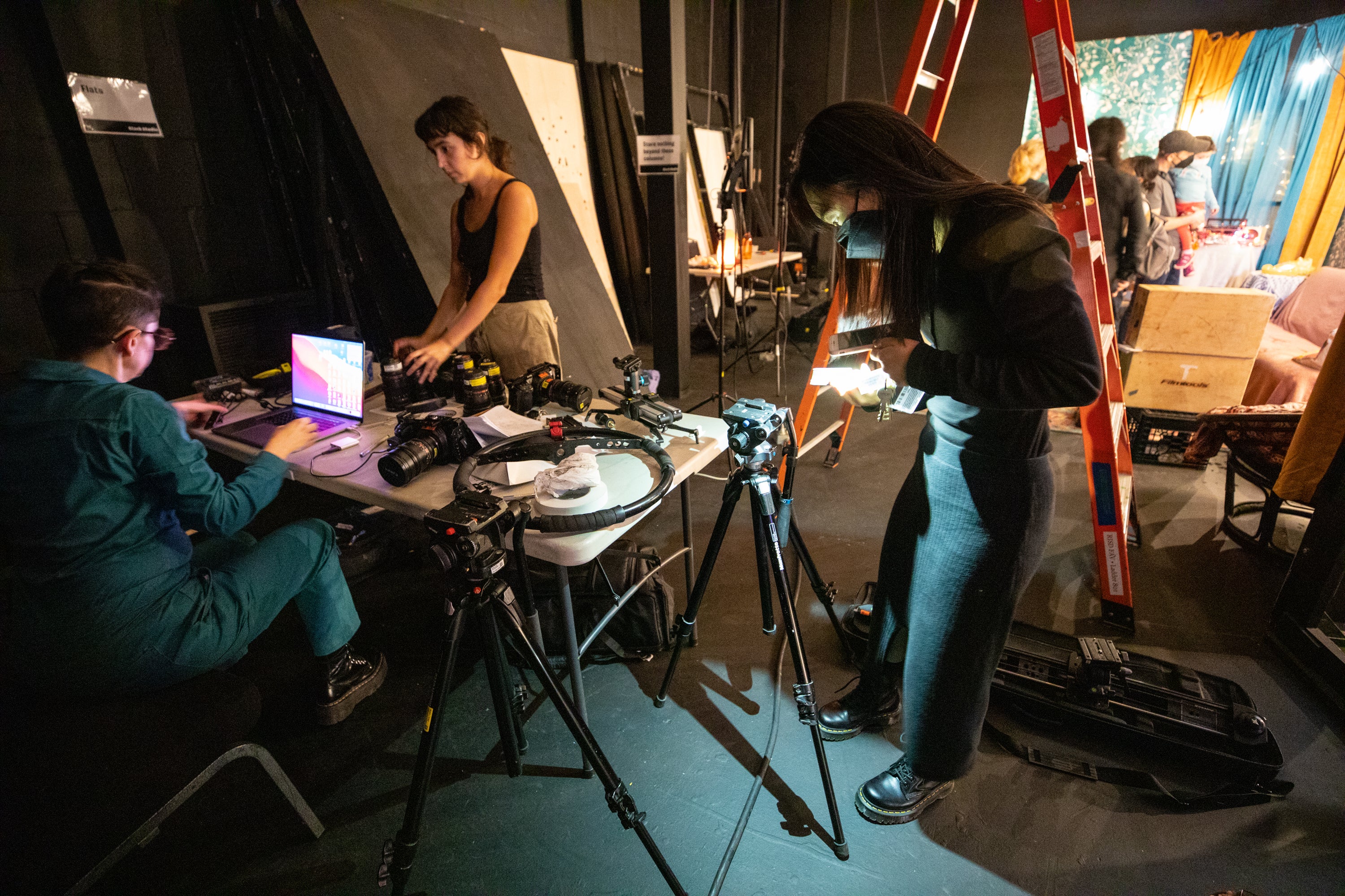 /Surrounded%20by%20camera%20and%20lighting%20equipment%2C%20students%20prepare%20to%20demonstrate%20live%20action%20filming.