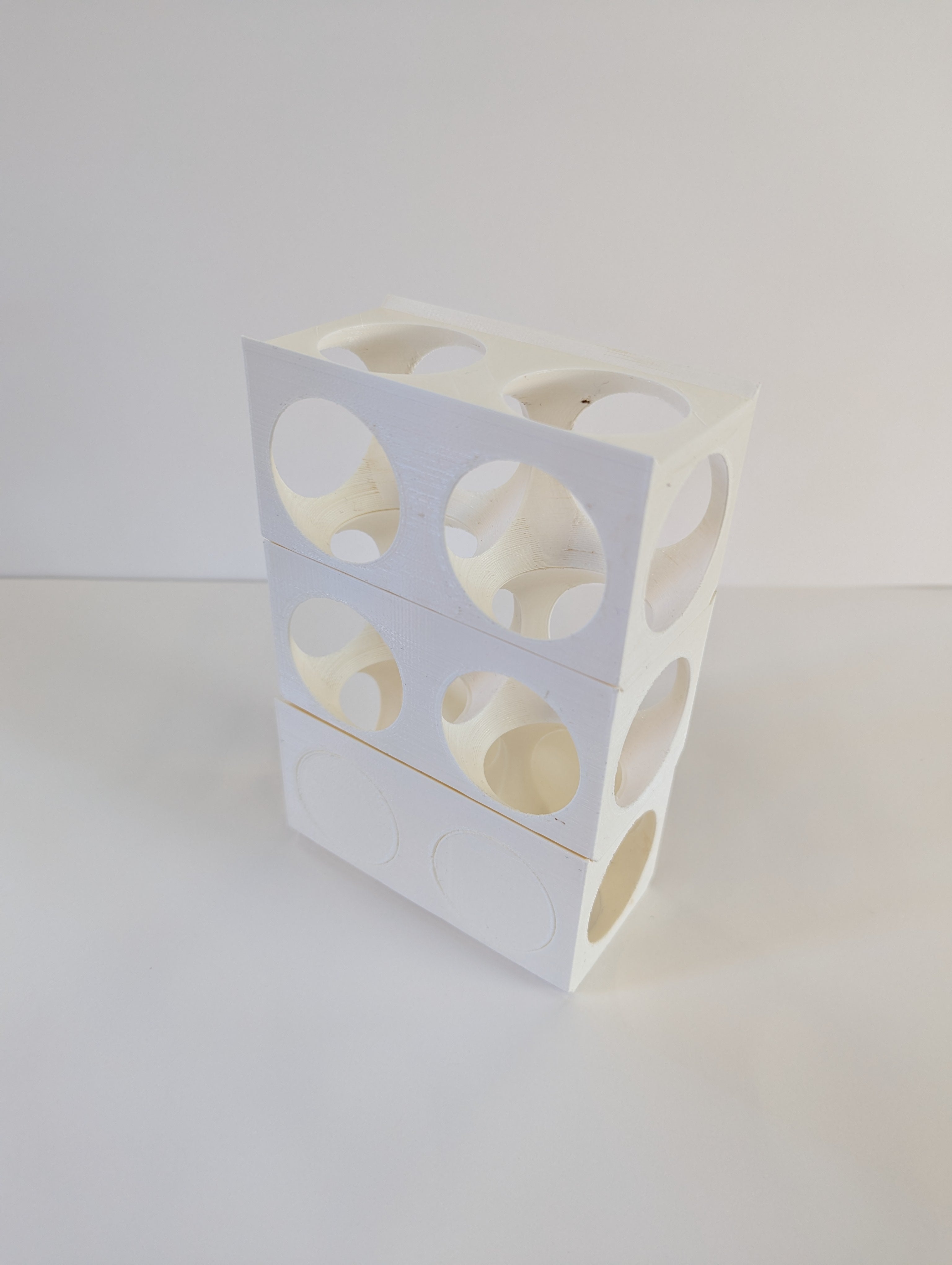 3D printed rectilinear block is voided via 2 spheres to create a skeletal frame.