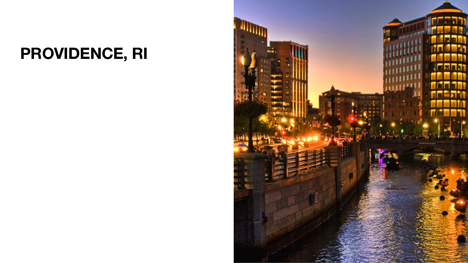 A Picture of Fire basins in the Providence Canal with the city lights around it. 