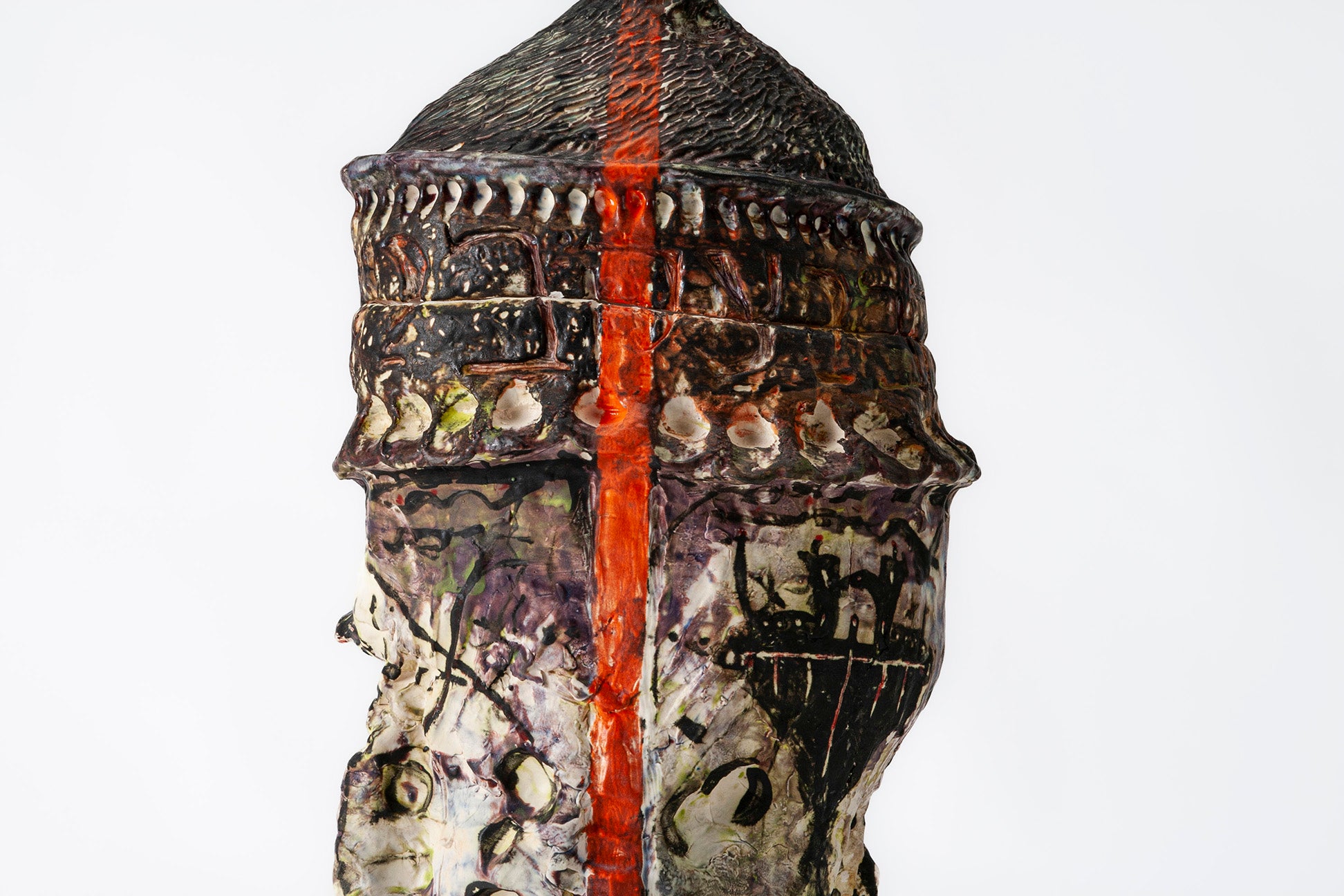 Close-up picture showing orange line and imagery drawn on large, ceramic jar