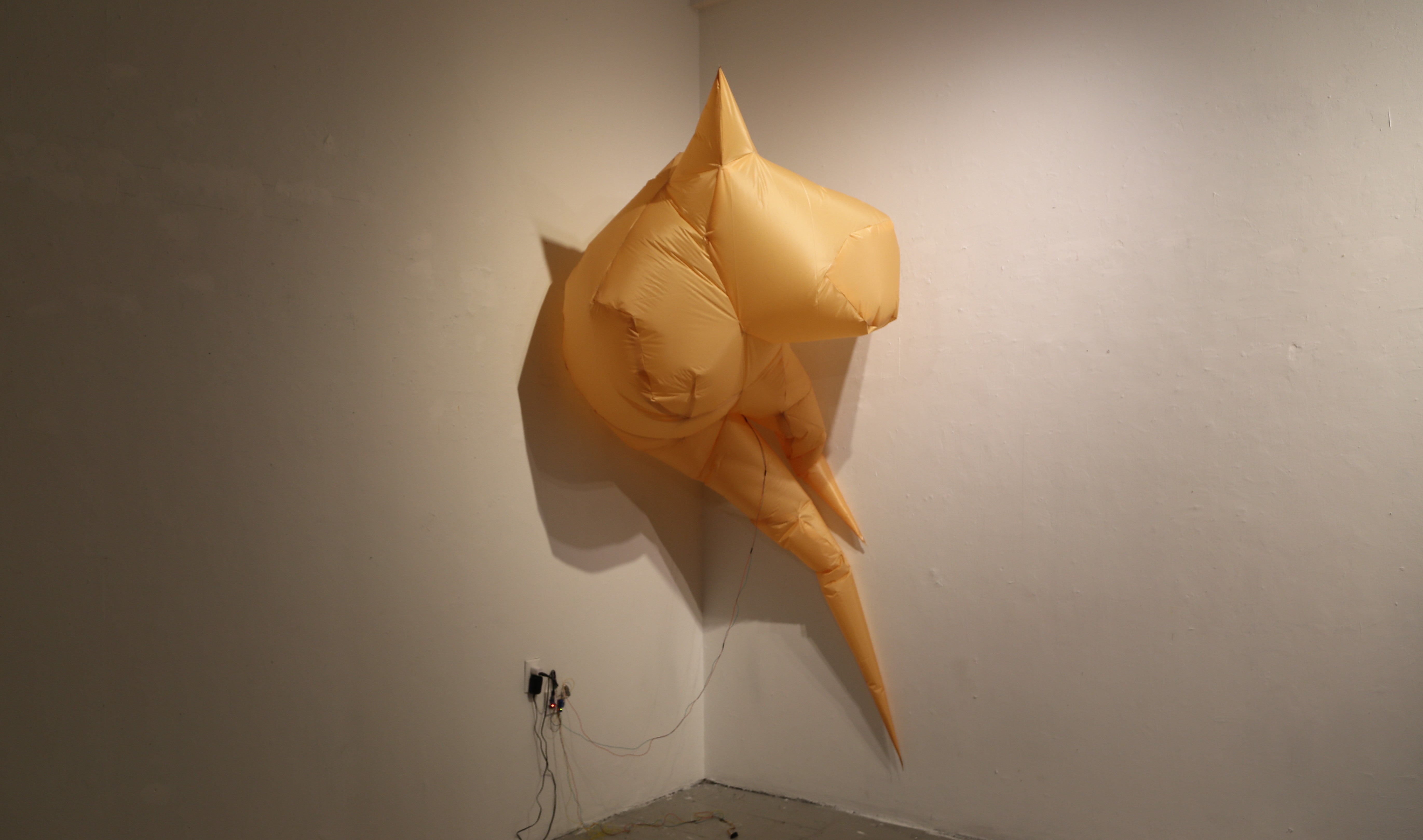 A fully inflated, mirage-like inflatable object made of fabric.