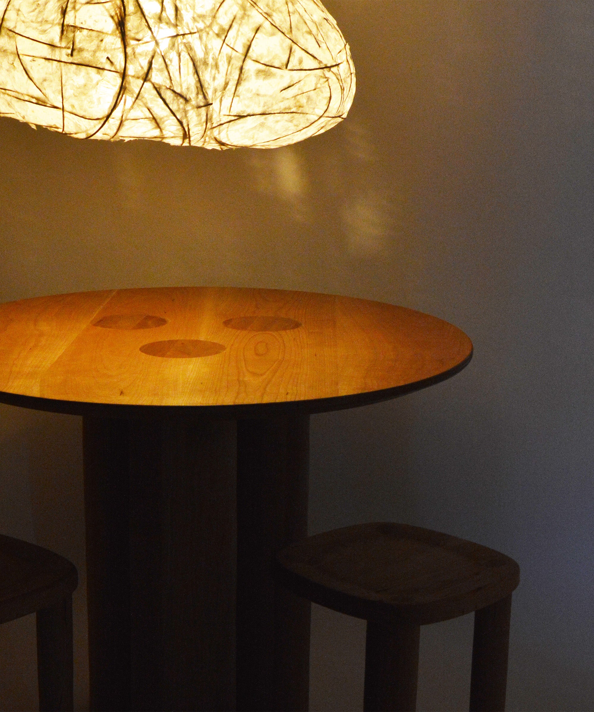 A circular dining table meant for gathering with loved ones.