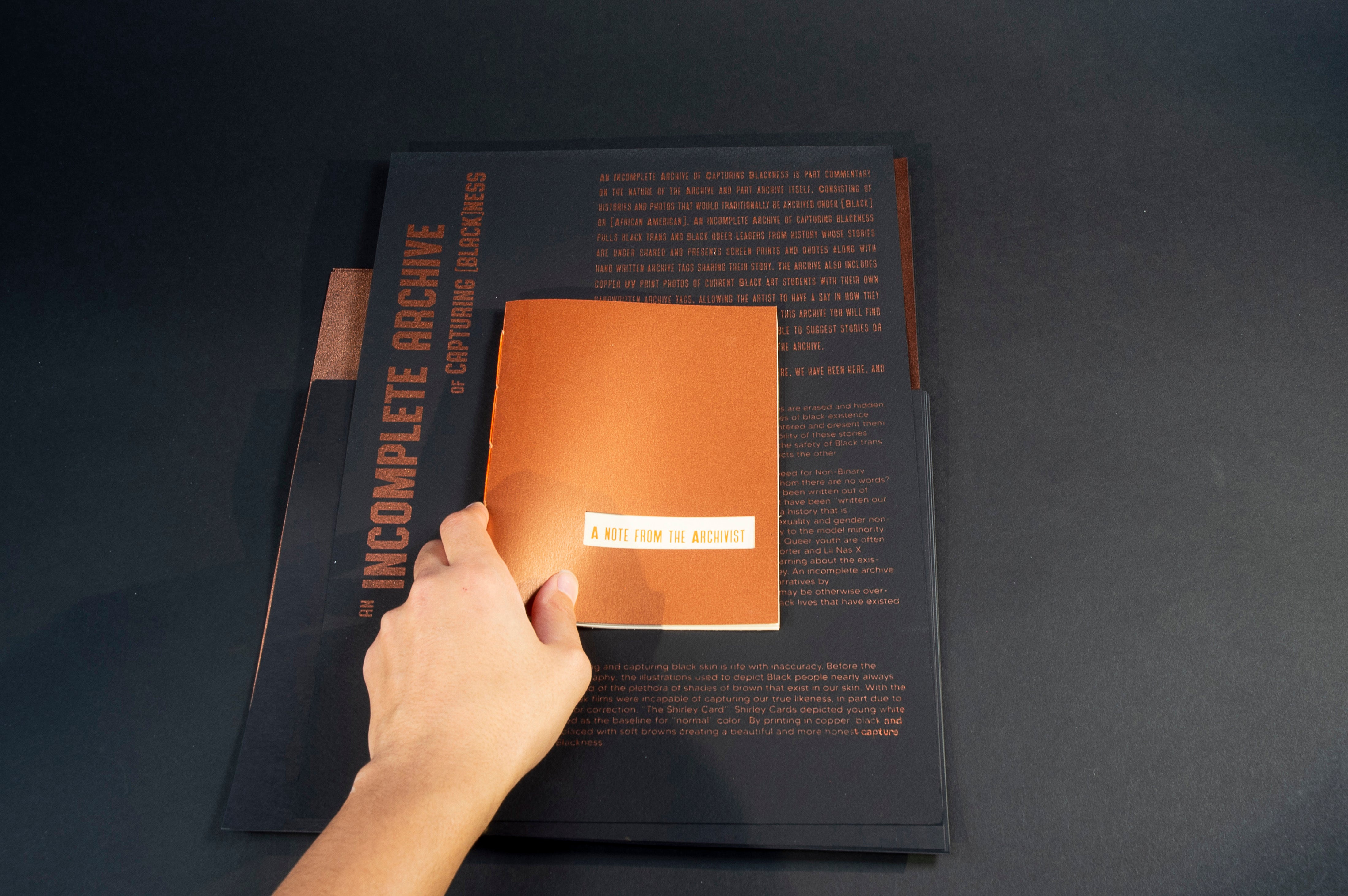 stack of copper colored prints