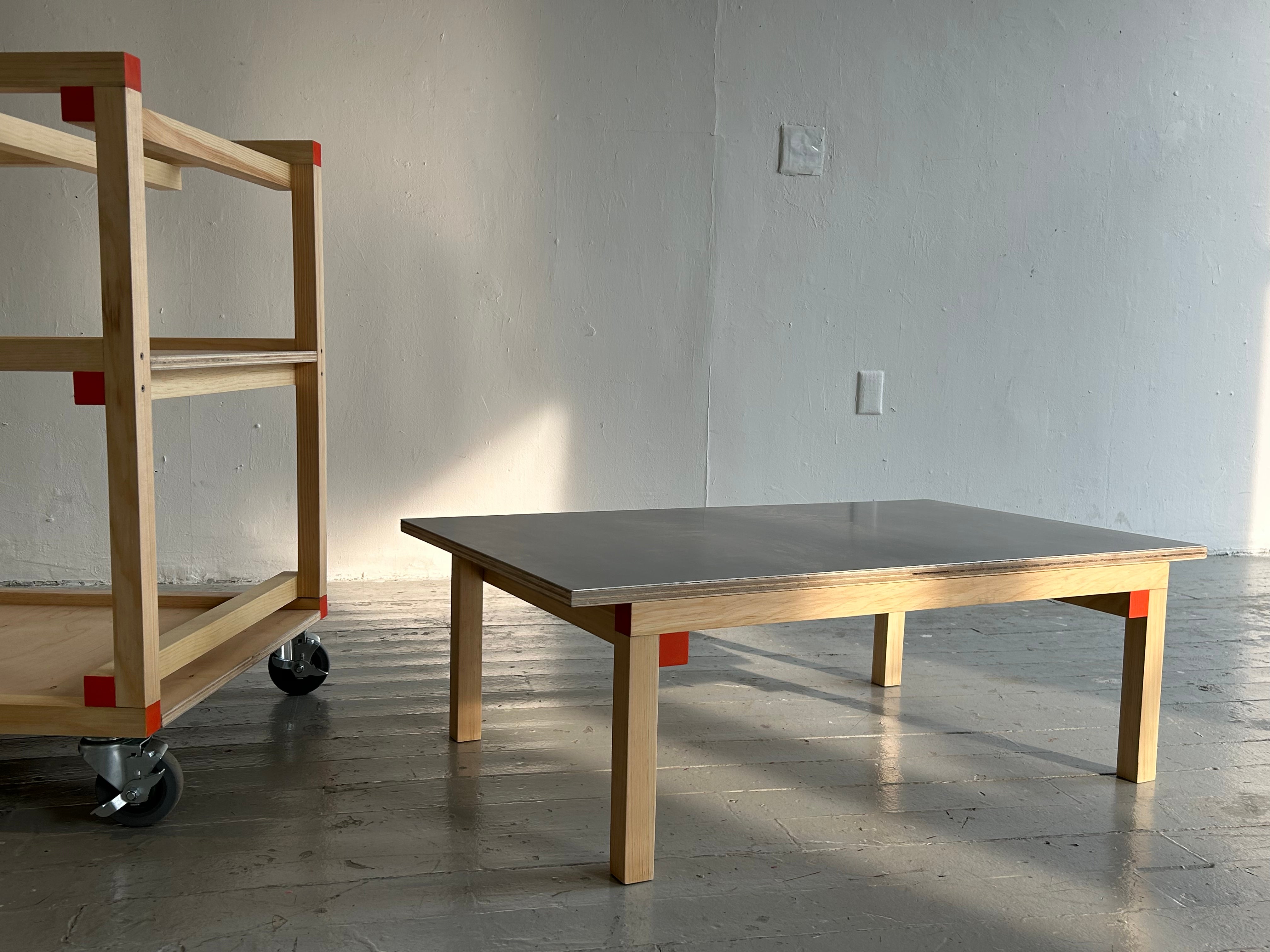 the two elements of the cart are separated, with the table on the floor
