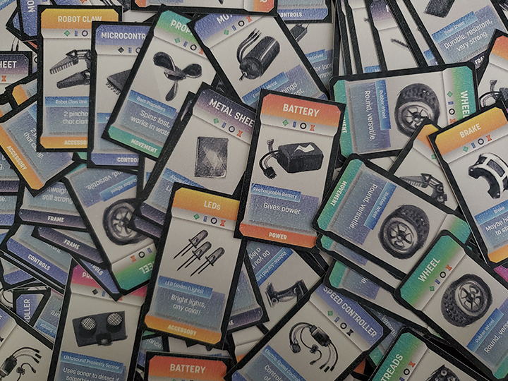 An overhead photo of the Mechanaire cards, strewn about in disarray.