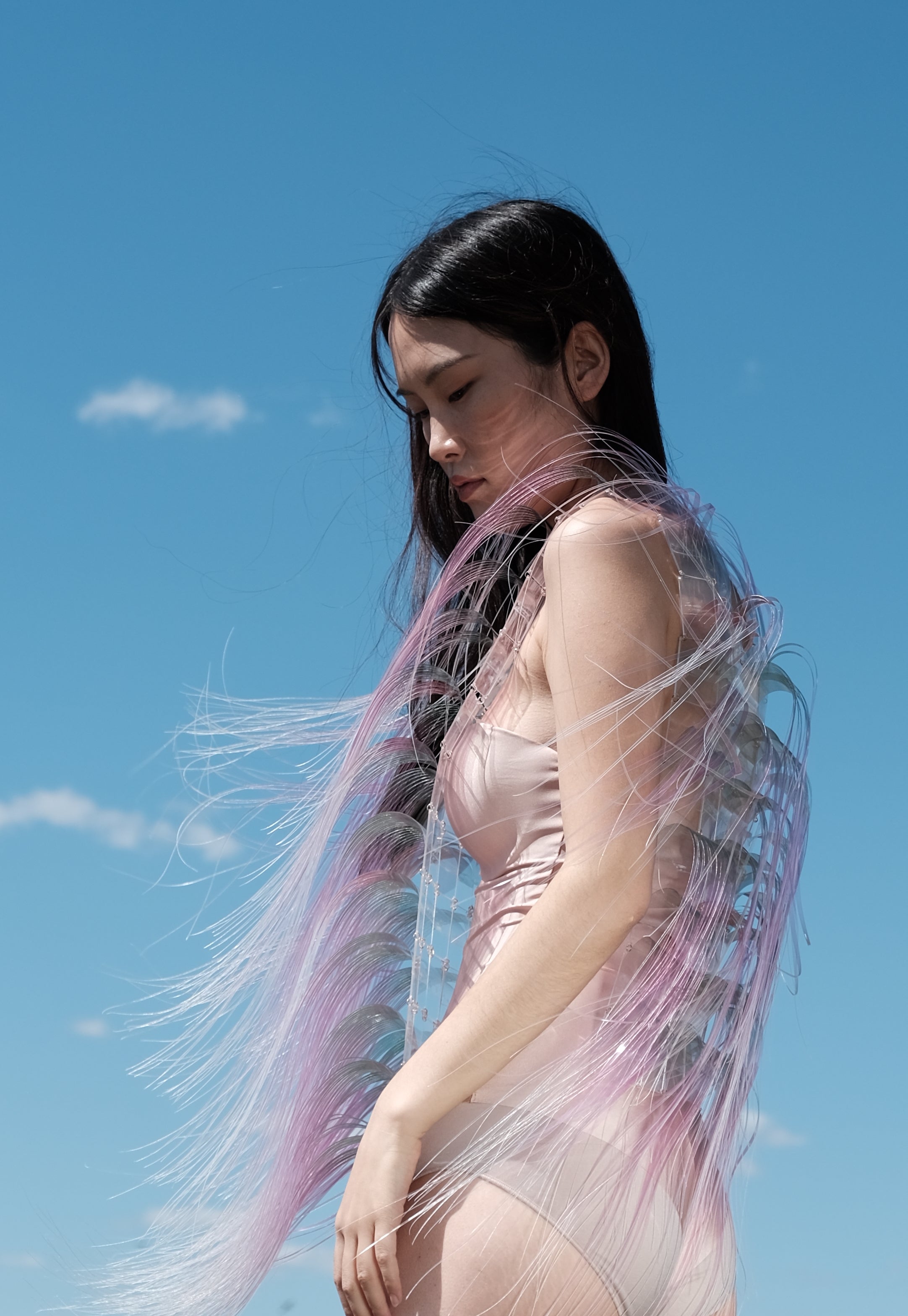 A girl's hair is blowed by wind