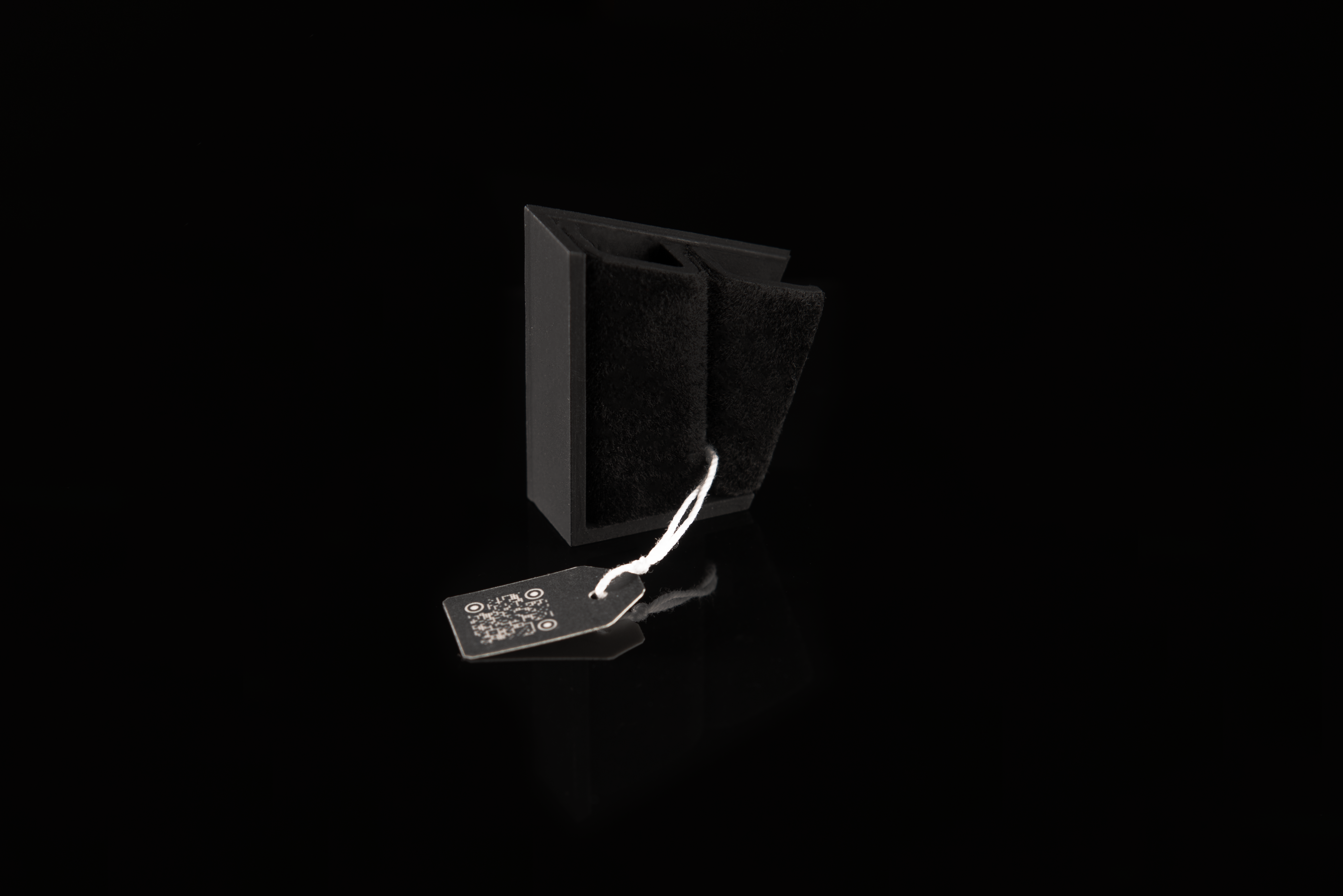 A single on table brooch without and rings are sitting on table.