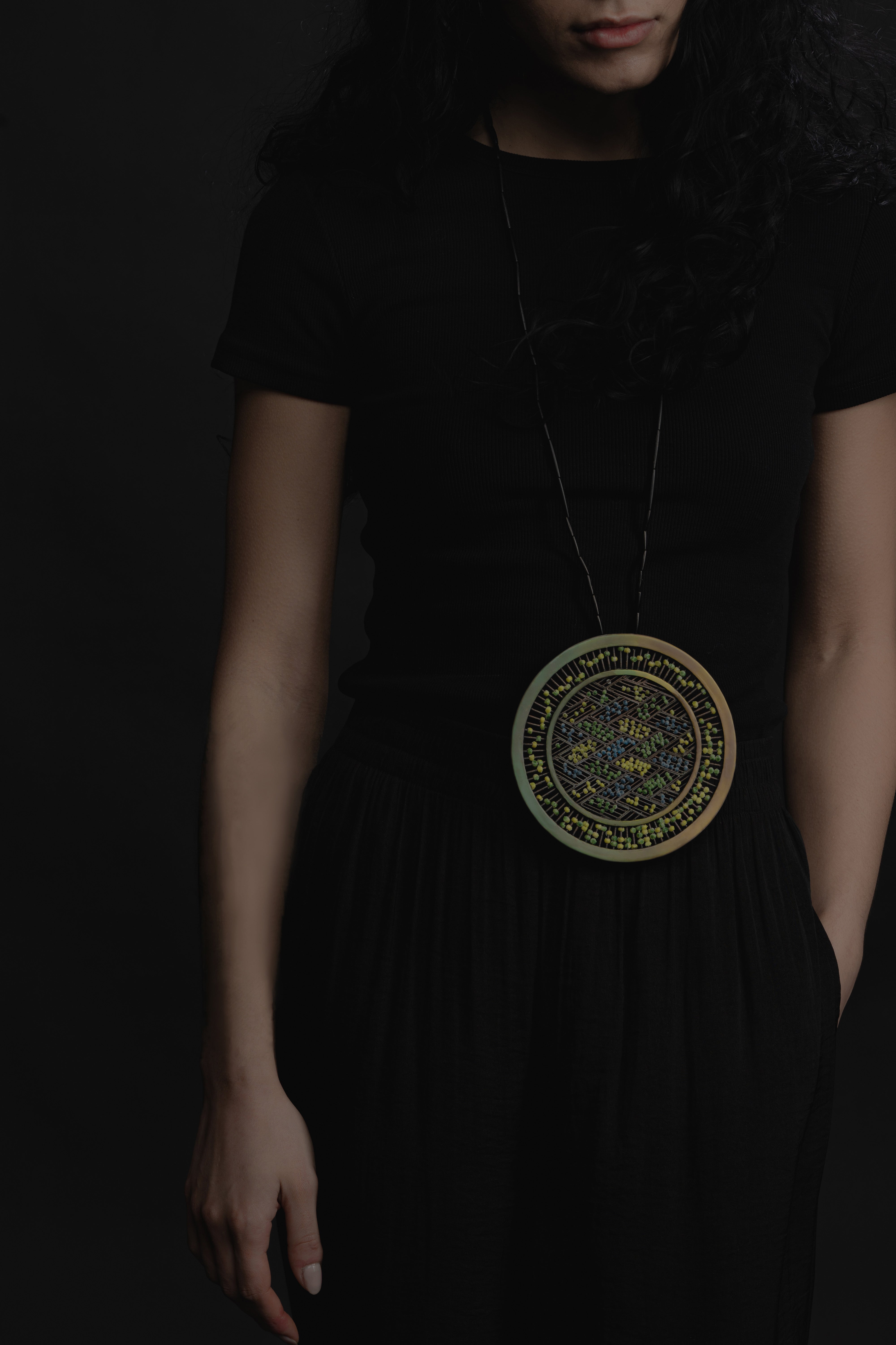 In a profound spiritual dialogue, a woman intimately connects with a powerful possession charm that serves as a transformative catalyst, bringing healing and solace to women affected by domestic abuse, fostering a profound sense of inner calm and emotional tranquility.