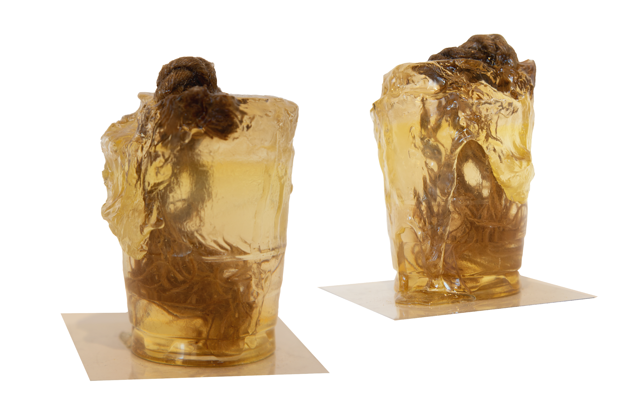 An epoxy and rope sculpture from two angles. 