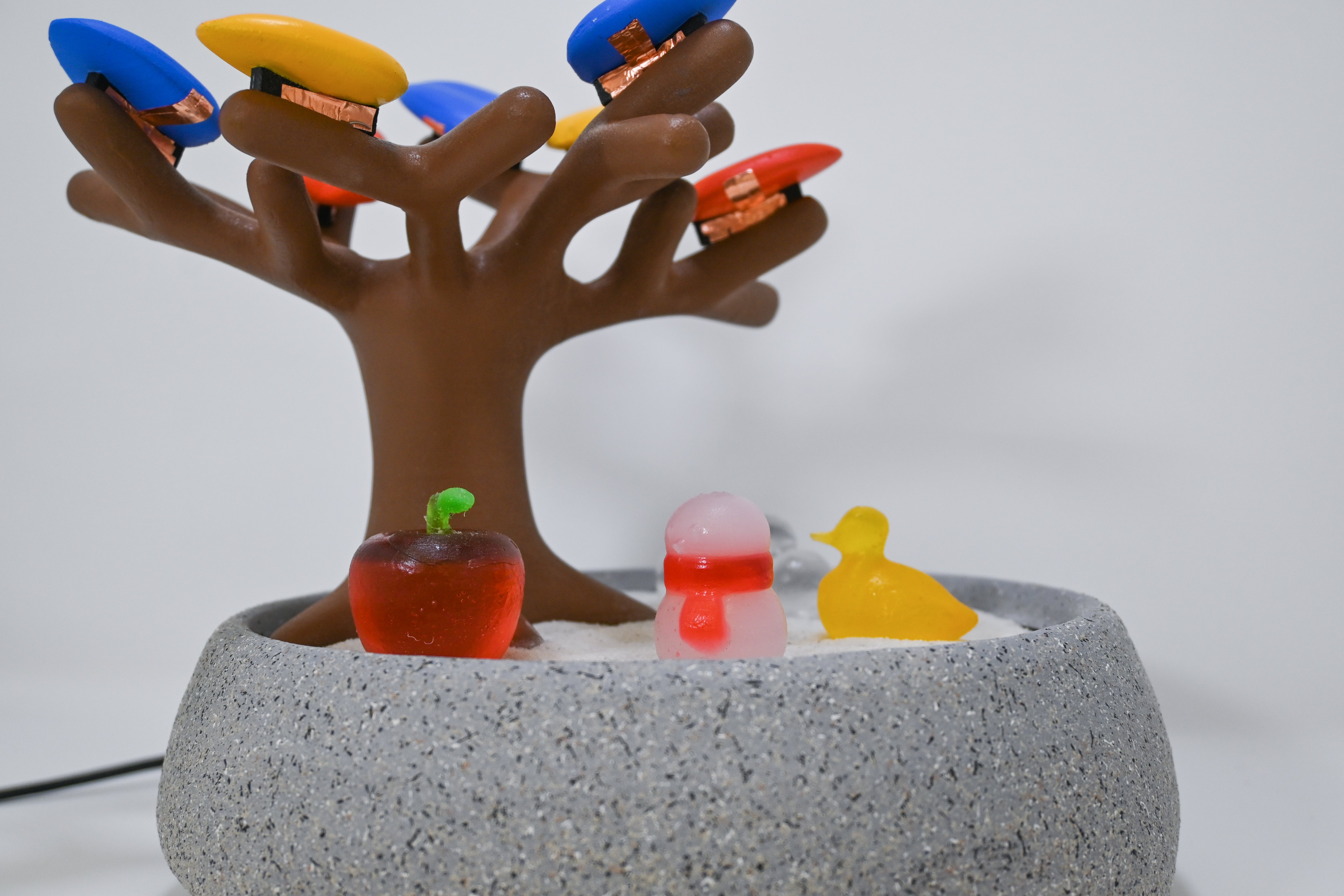 MindfulNest with apple, bird, and snowman pick-and-place objects.