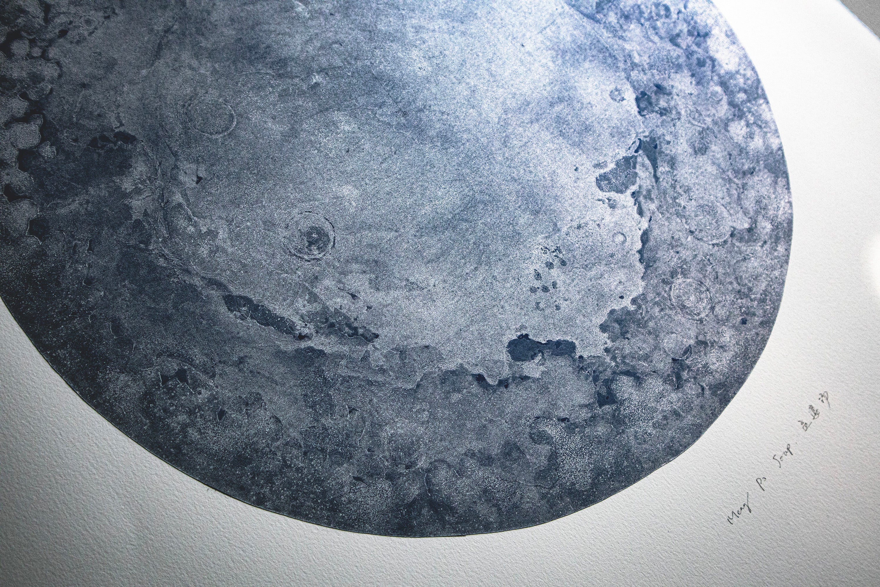 Detail of the silver moon, you can see the fog-like dark blue craters and silver plains.