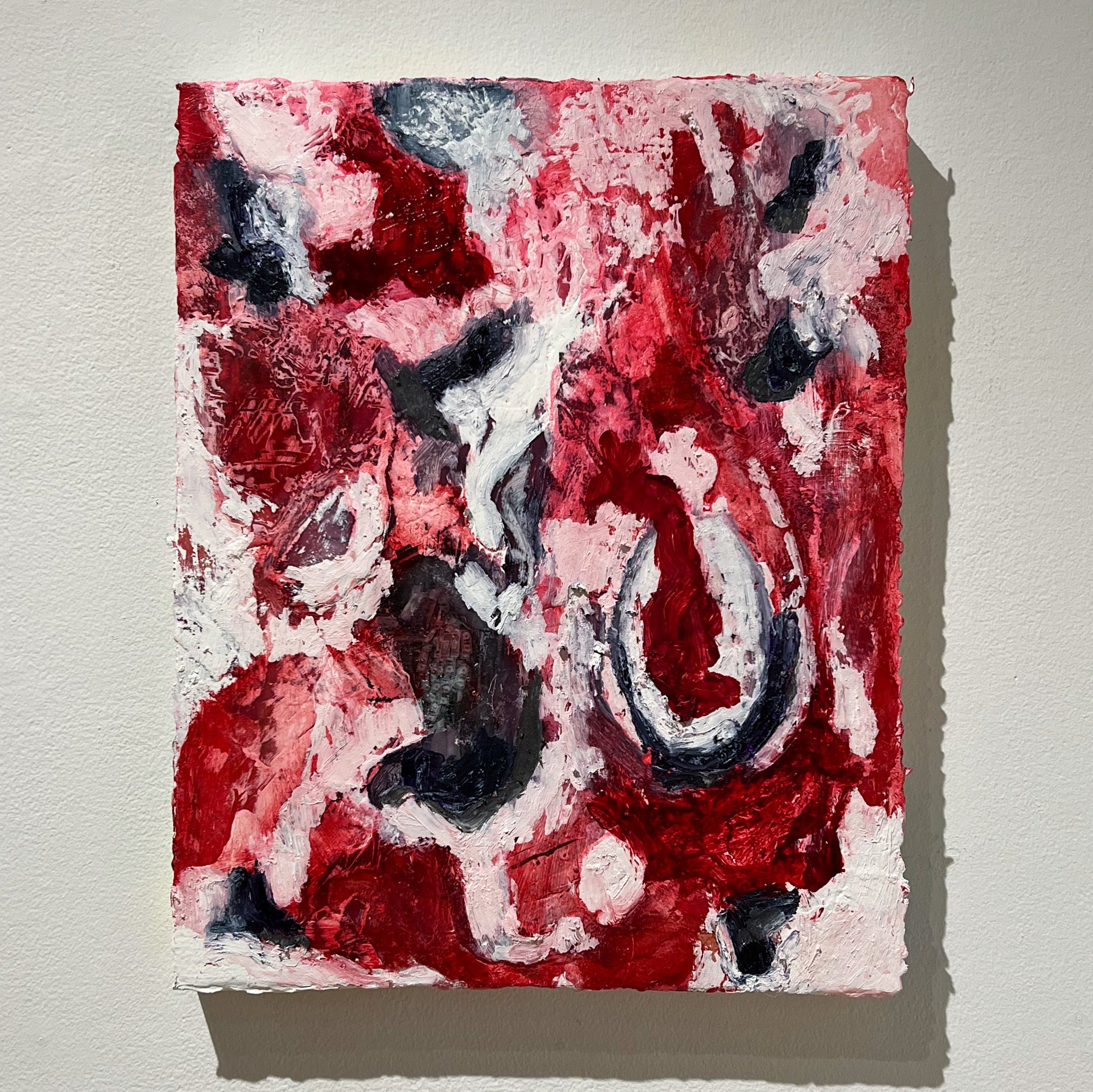 A layered painting with visible areas and others with accumulated material 