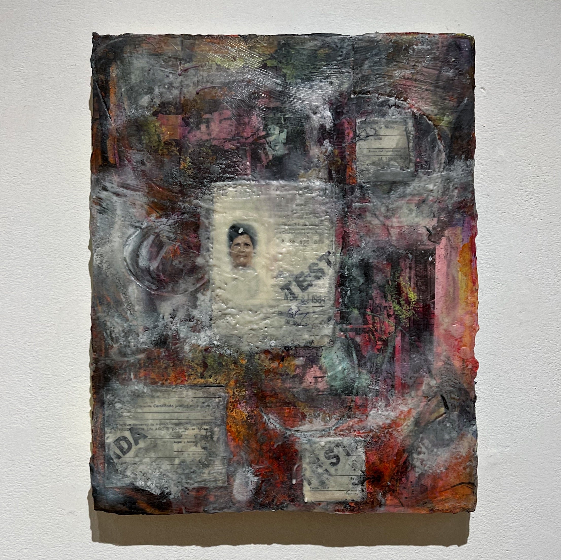 A layered painting with visible areas and others with accumulated material 