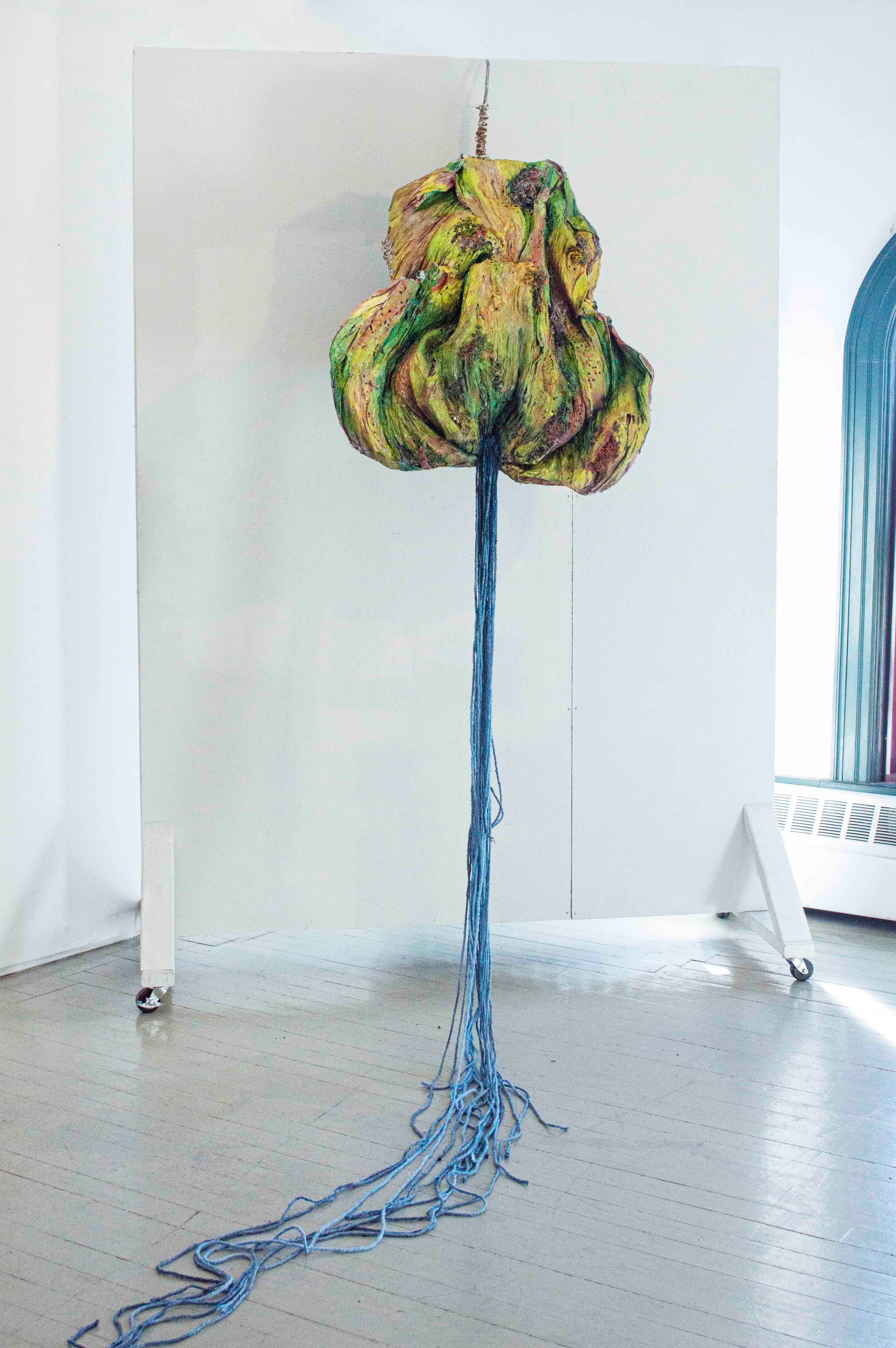 2022. Plastic bags, acrylic and spray paint, steel wool, architectural bushes, latex, mop rope, scrap 35 x 47 in (top piece) + 129 in (mop rope)