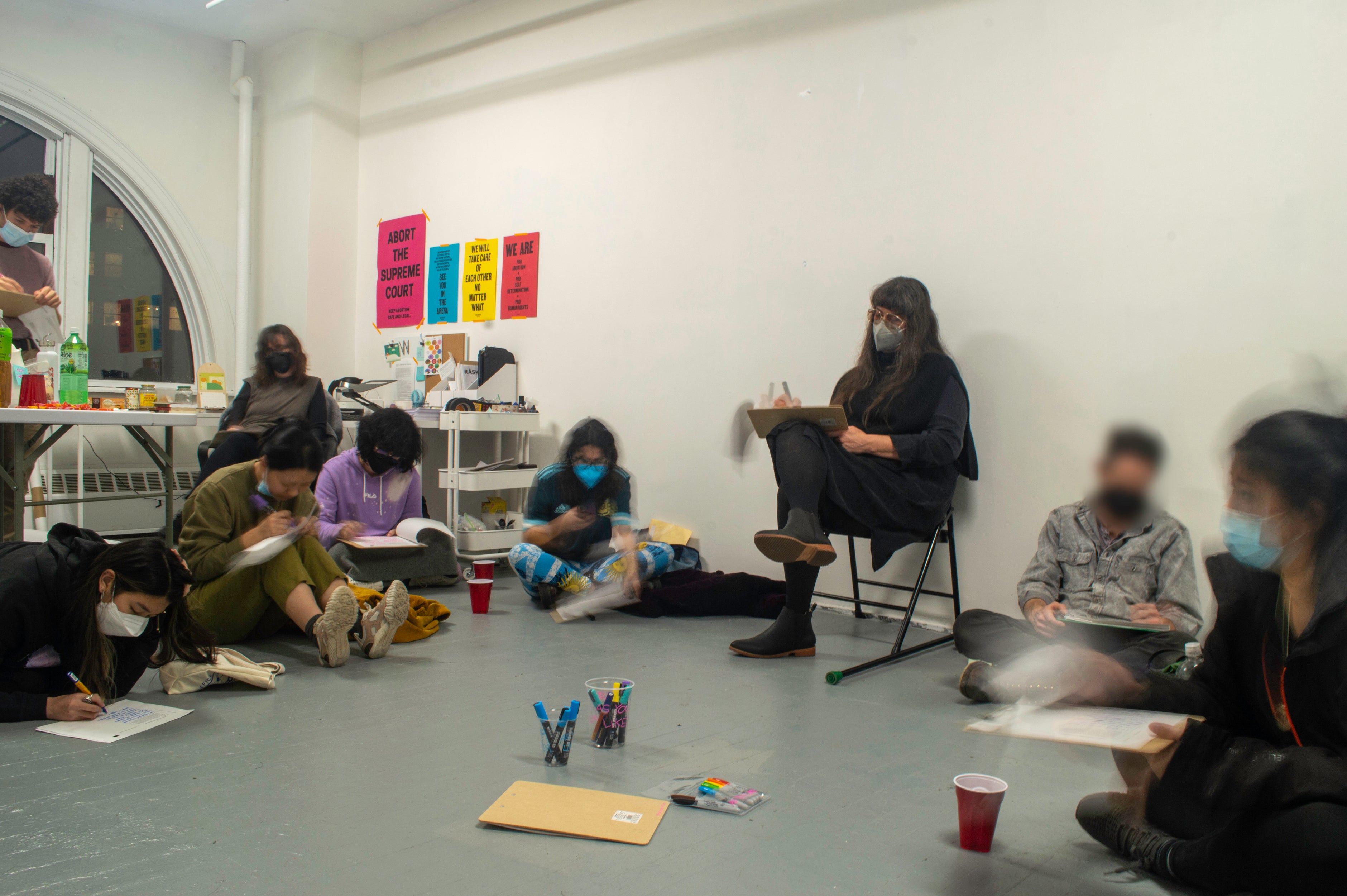 Iteration #5 on a timeline wall installation presents photo documents and the artist’s note on pastel yellow, pink, and blue post-its, surrounding a bold black line marked with ‘#5’ and ‘October 12, 2022.’