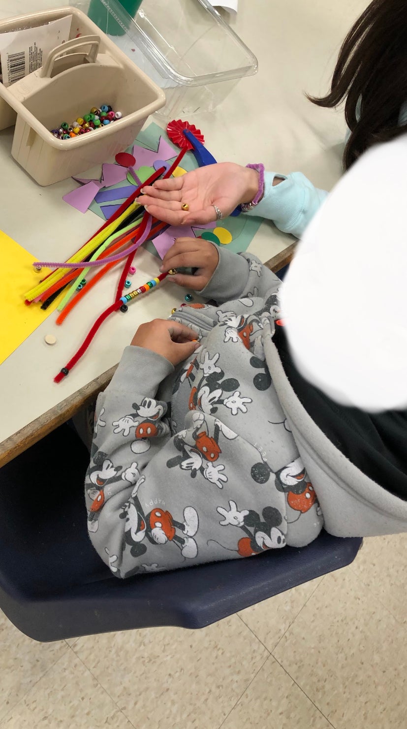 Intensive Special Education (ISE) class at Hugh Cole Elementary School working at stations with various sensory materials. Photographed by Lynne Ramos. 