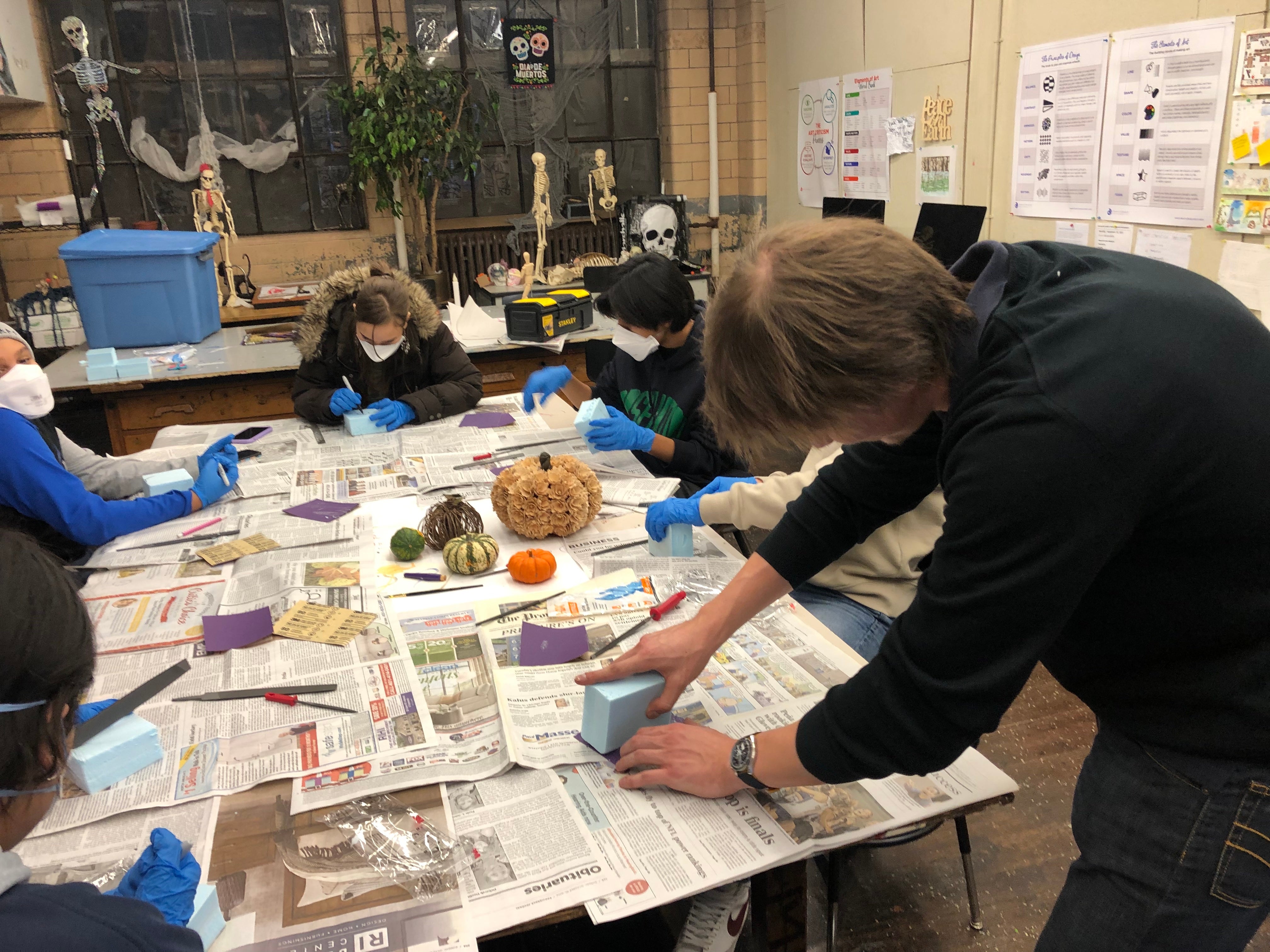 Seva Simone demo’ing working with blue foam in his Project Open Door class called Design the Future at Hope High School. 