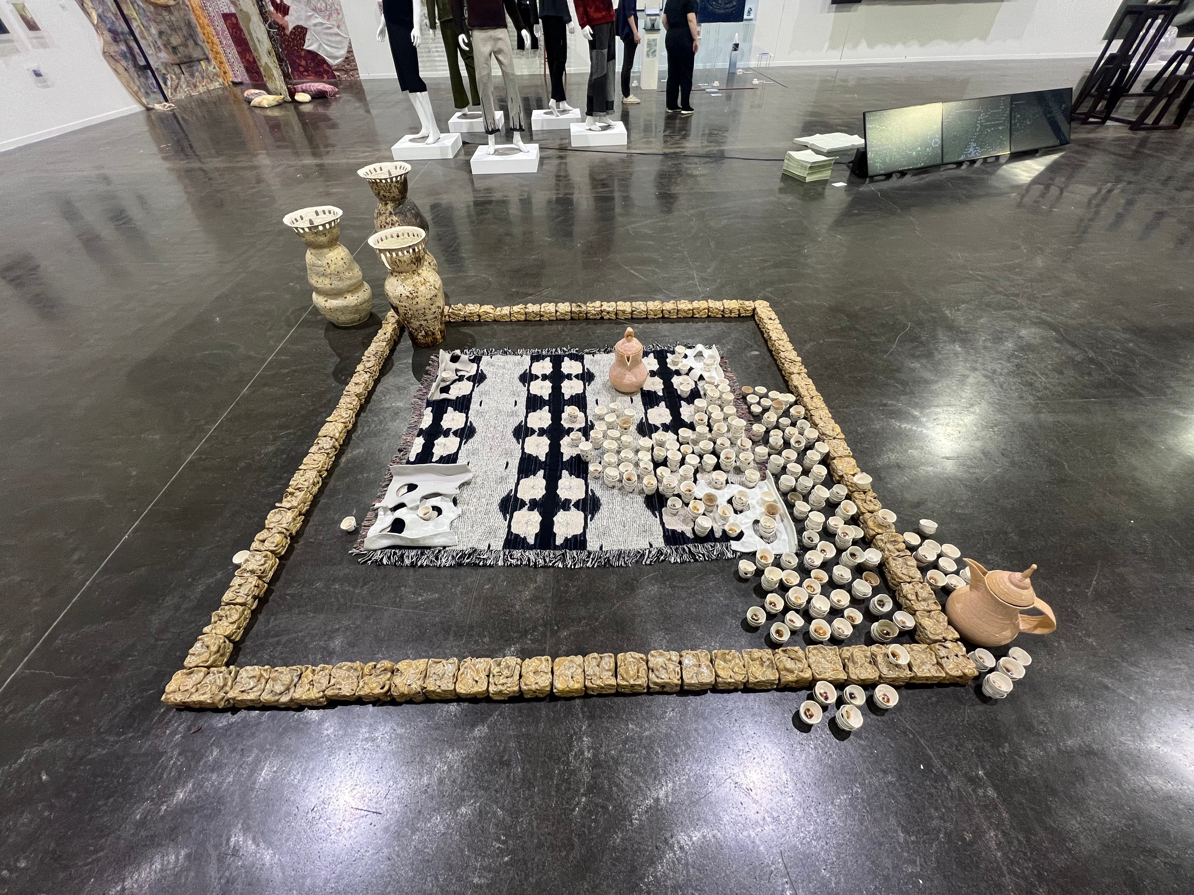 Coffee pots and cups on a rug