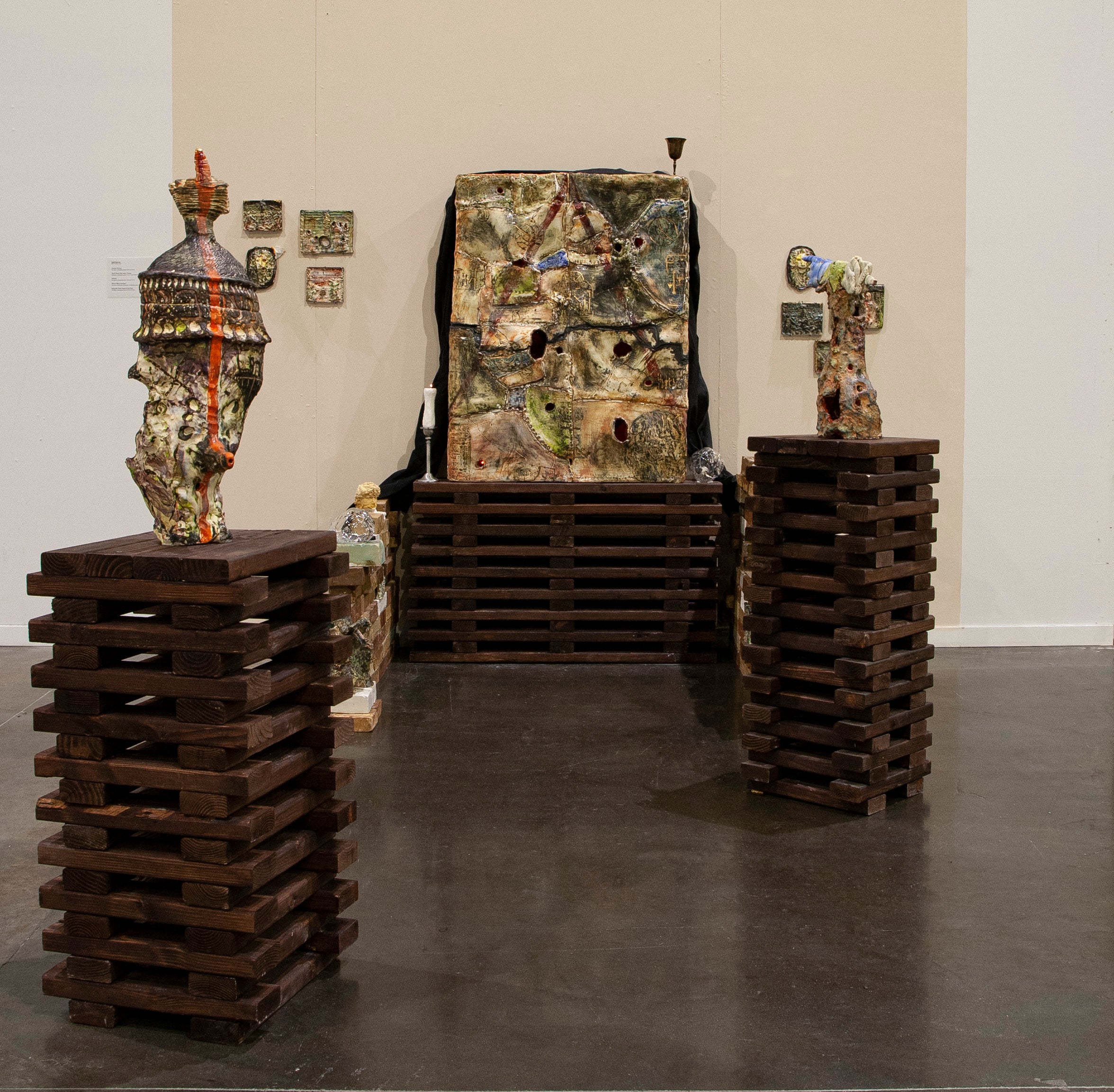installation of big porcelain box with multiple ceramic objects to the sides